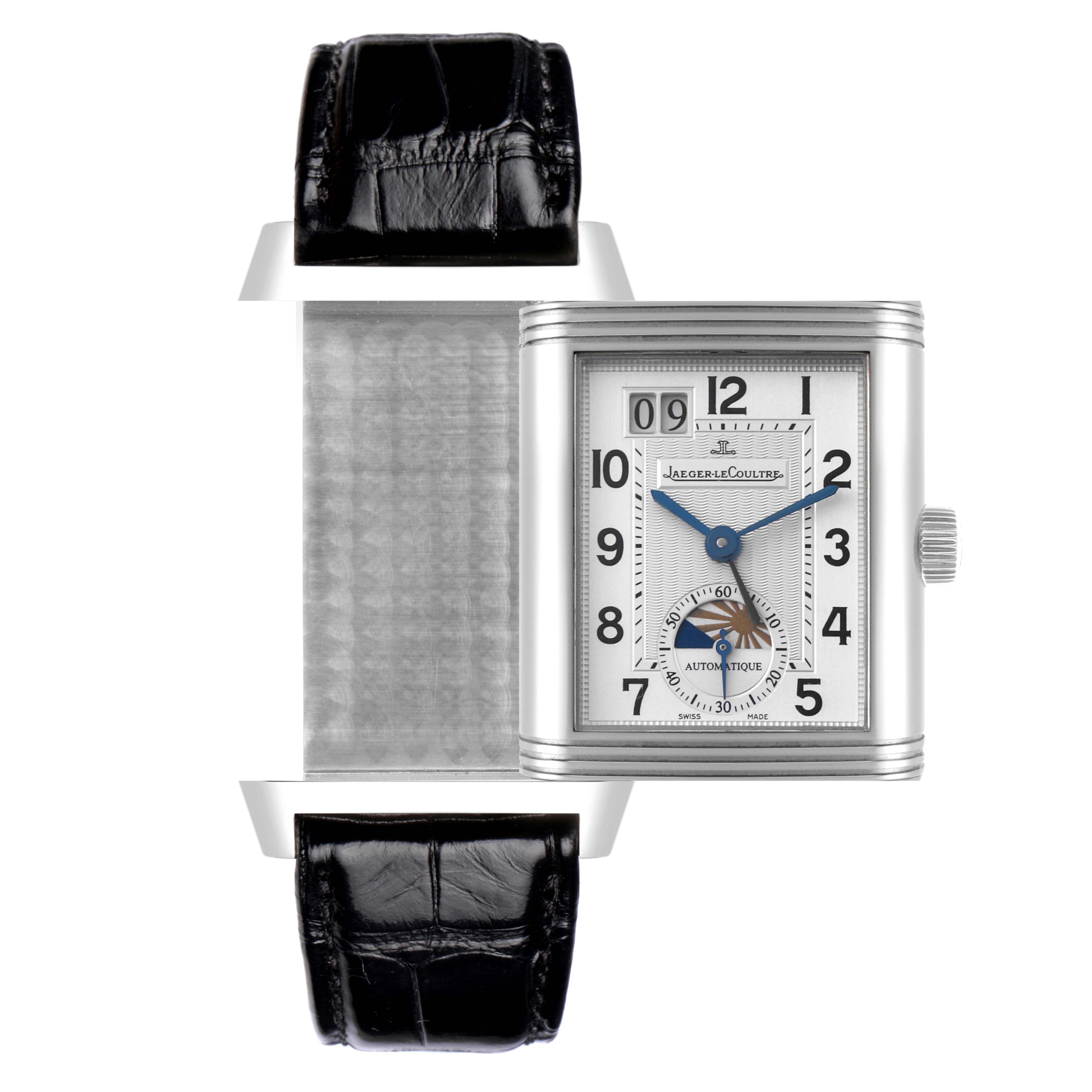 The Jaeger-LeCoultre Reverso watch is shown from the front with an open case, revealing the detailed dial and black leather strap.