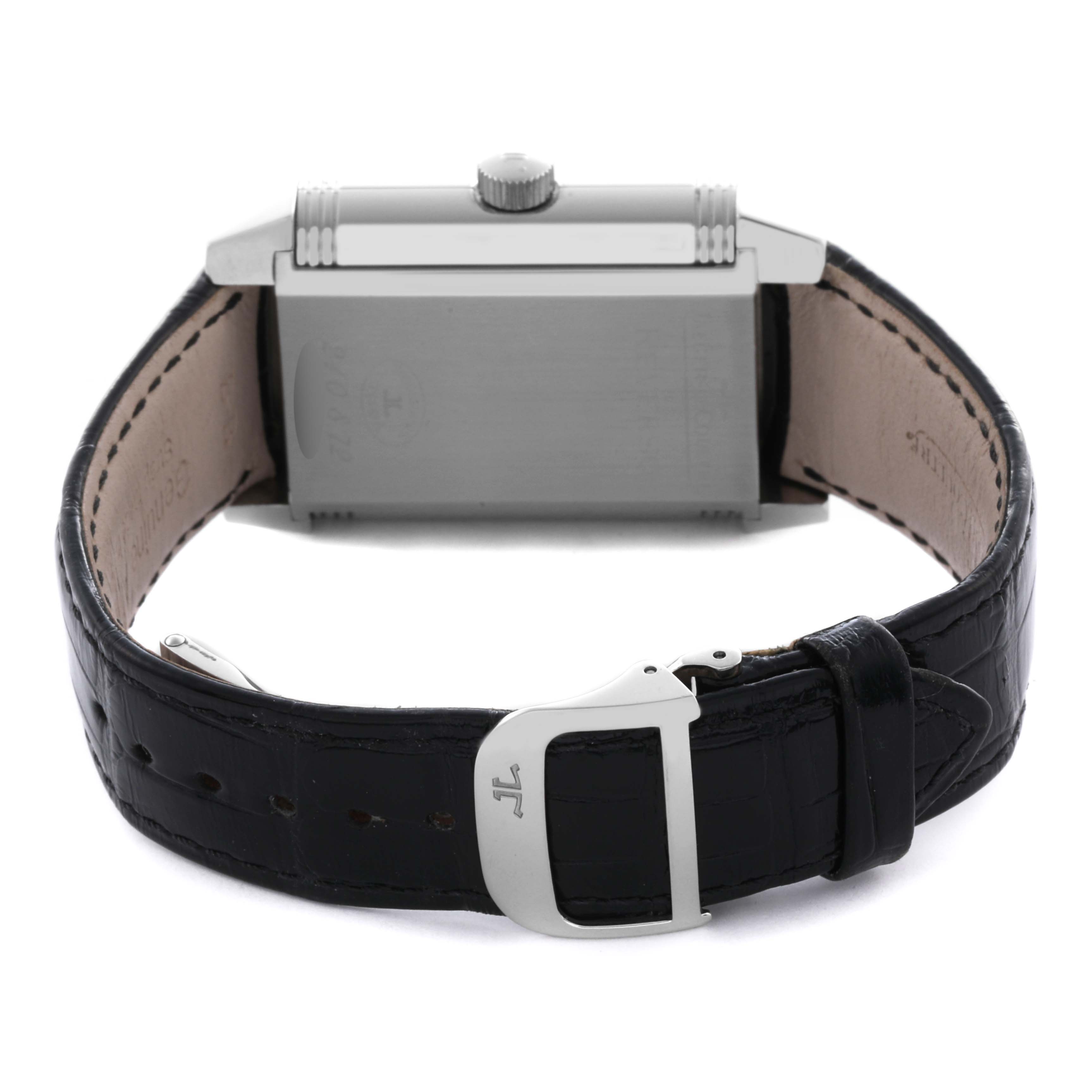 The Jaeger LeCoultre Reverso Q3038420 Men's Stainless Steel Silver Dial Q3038420 Men's Stainless Steel Silver Dial watch is shown from the side, highlighting the swivel case and leather strap with a buckle.