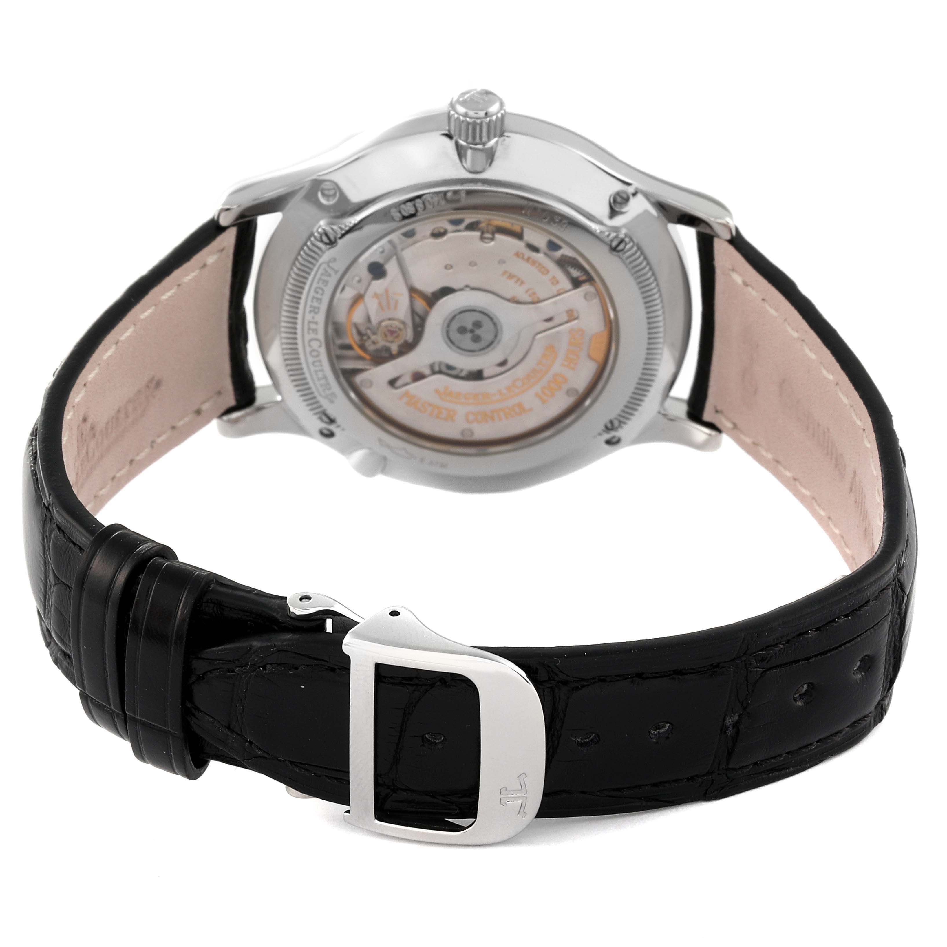 The image shows the back view of a Jaeger LeCoultre Master 140.8.80.S Men's Stainless Steel Black Dial 140.8.80.S Men's Stainless Steel Black Dial watch, highlighting the movement and black leather strap with a silver clasp.