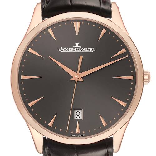 The Jaeger-LeCoultre Master model is shown from a front angle, highlighting the dial, hands, date window, and leather strap.