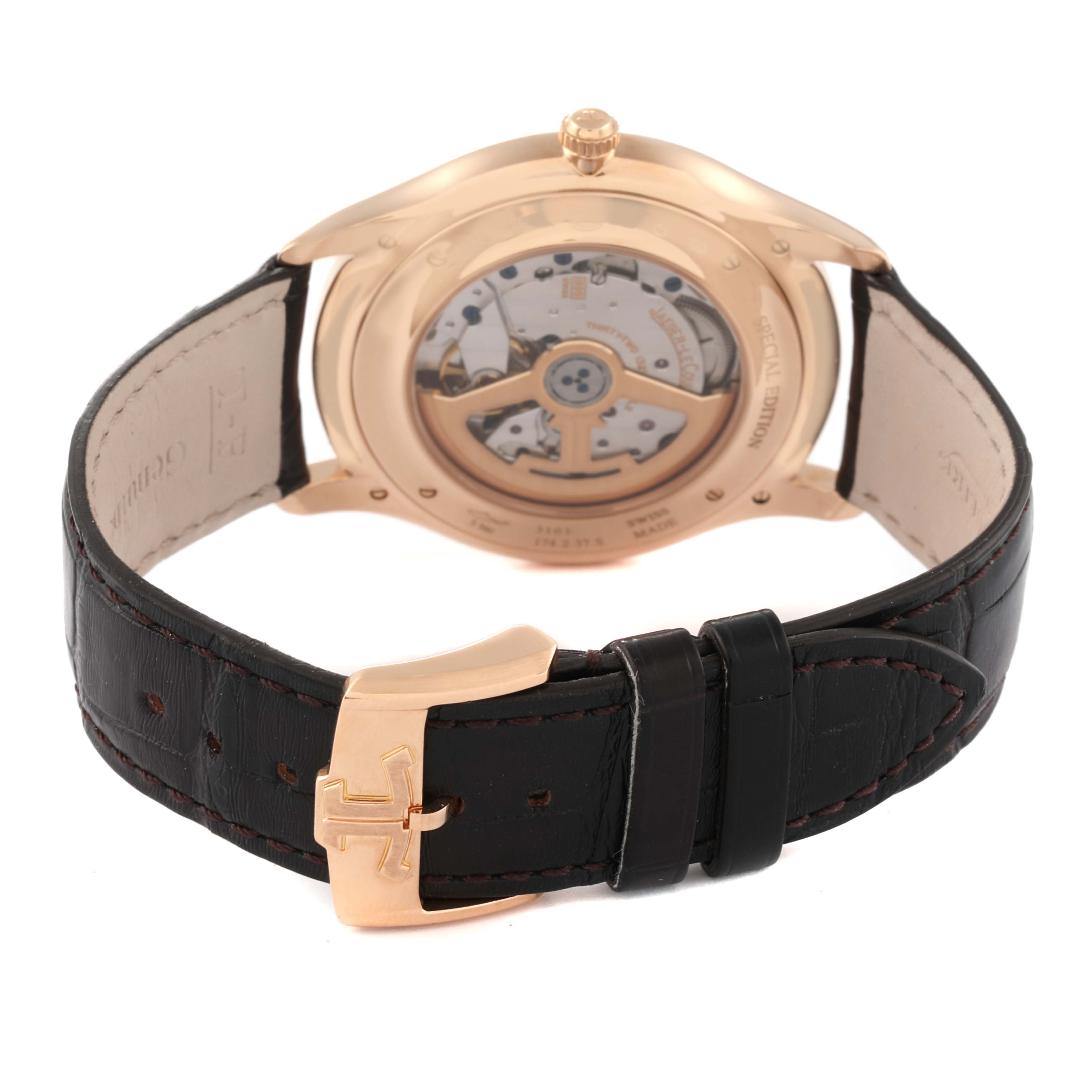 The image shows the rear view of the Jaeger-LeCoultre Master model watch detailing its movement and black leather strap.