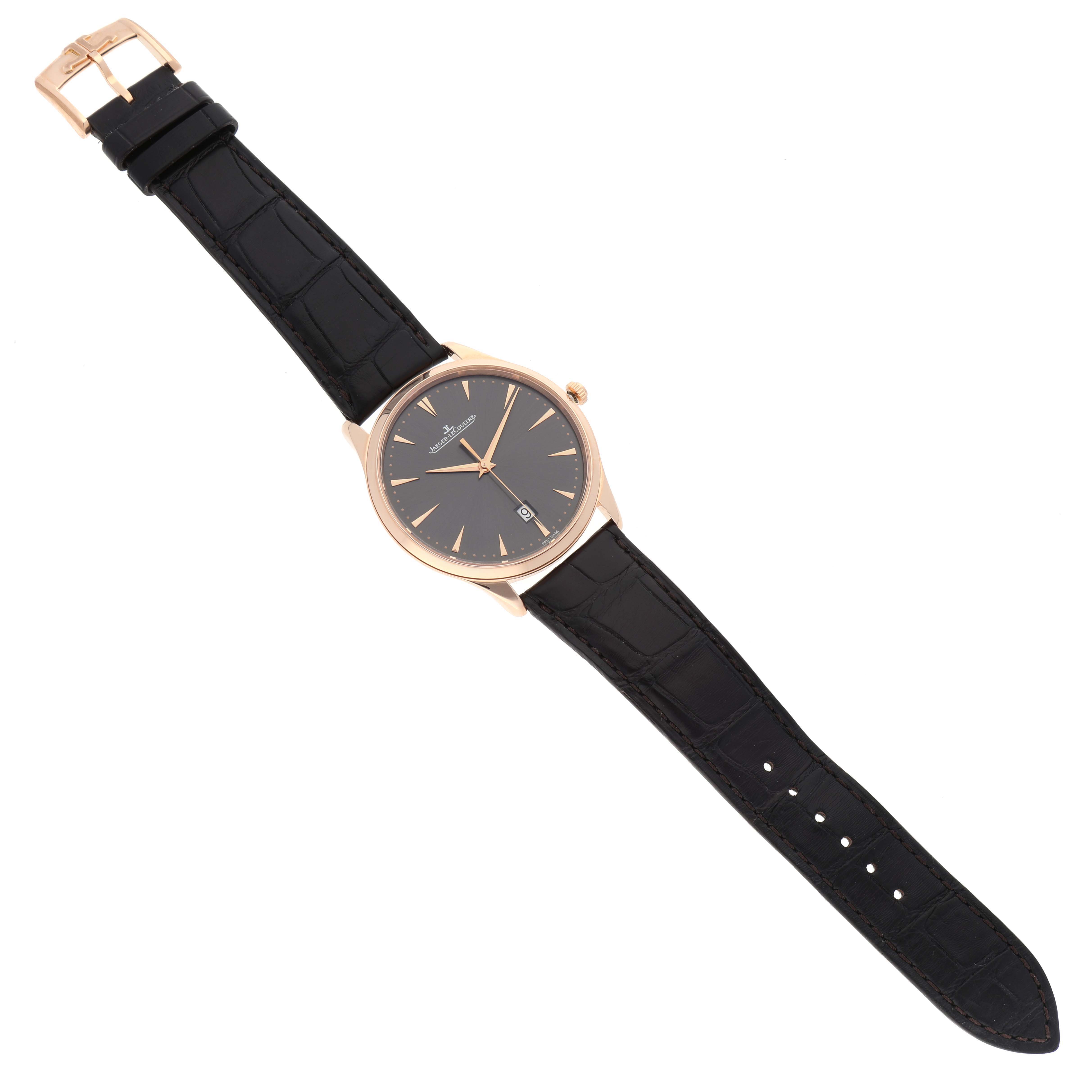 The Jaeger LeCoultre Master 174.2.37.S Men's Rose Gold Grey Dial watch is shown from a top view, displaying the face, black leather strap, and buckle.