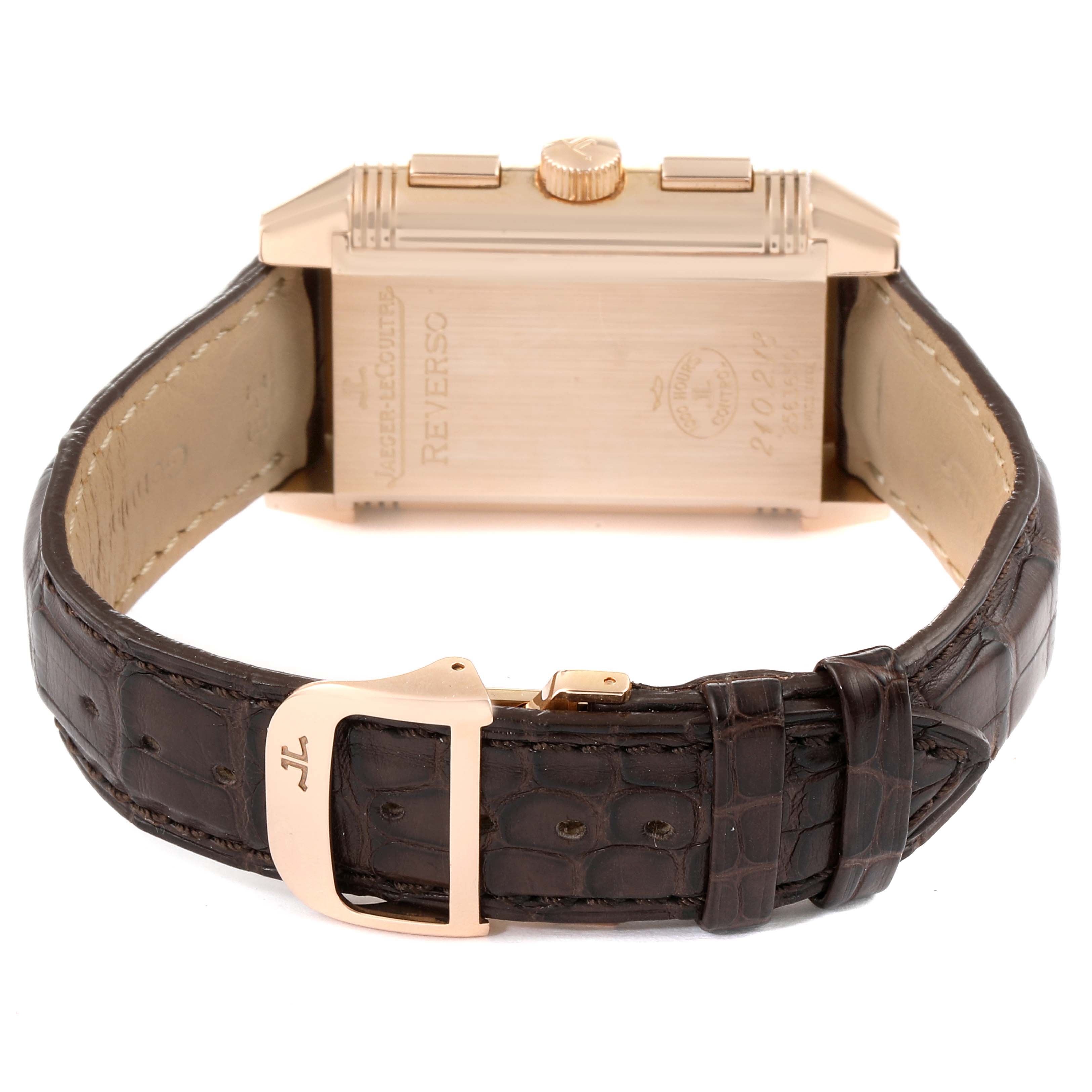 The image shows the back of a Jaeger-LeCoultre Reverso watch, highlighting its leather strap and clasp.