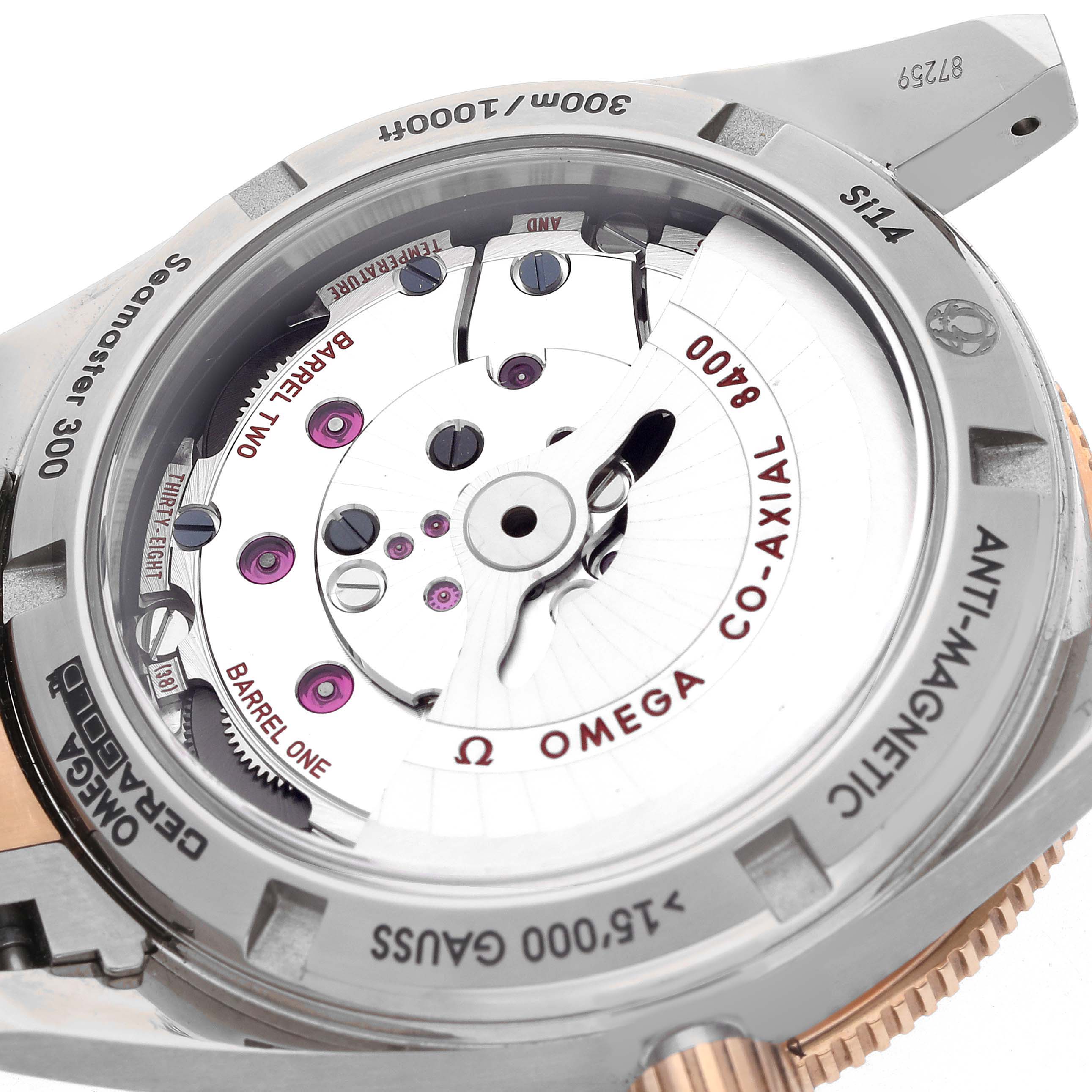 The Omega Seamaster 233.60.41.21.03.001 Men's Steel and Gold (two tone) Blue Dial 233.60.41.21.03.001 Men's Steel and Gold (two tone) Blue Dial watch is shown from the back, displaying its Co-Axial 8400 movement and engraved details around the edge.