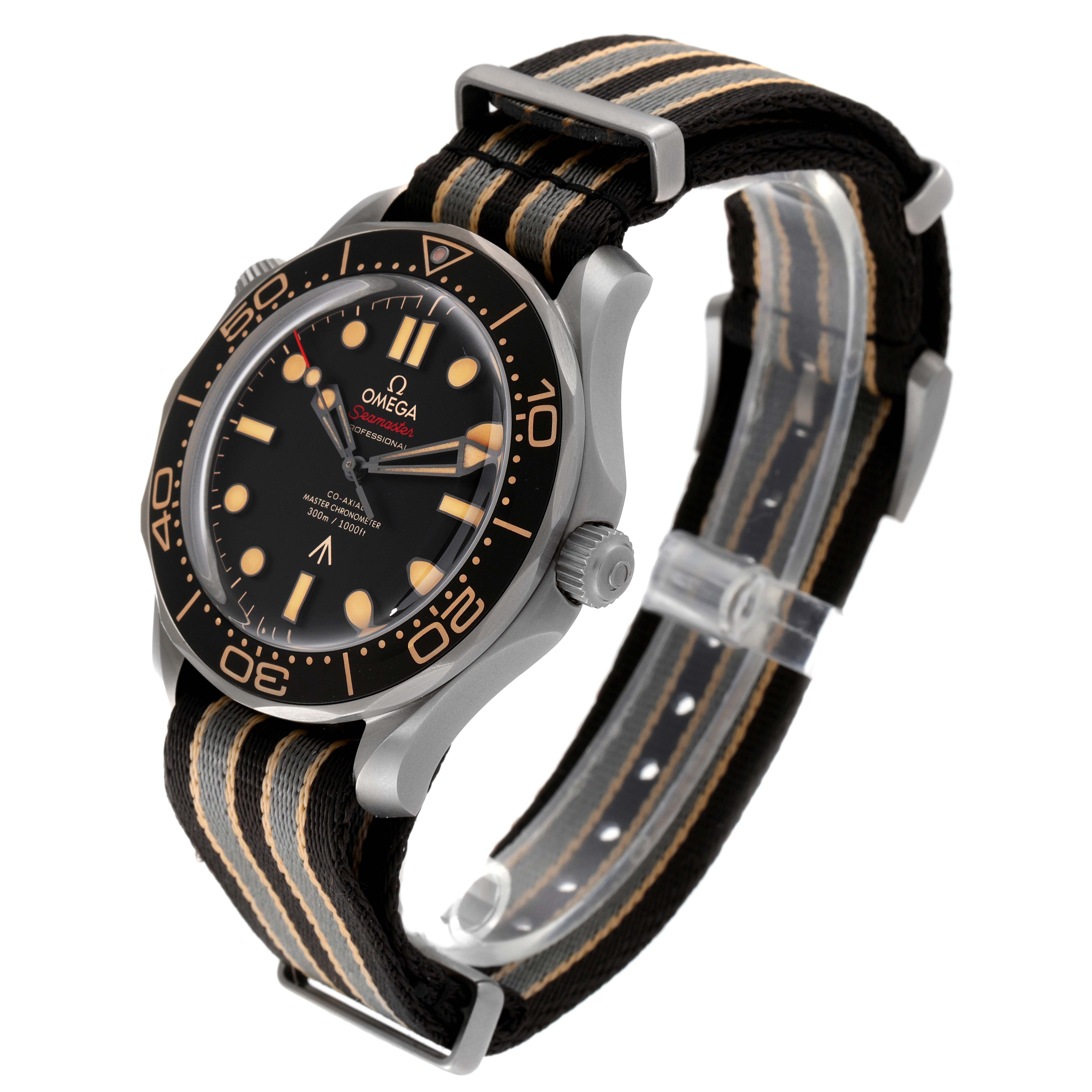 The Omega Seamaster 210.92.42.20.01.001 Men's Titanium Brown Dial 210.92.42.20.01.001 Men's Titanium Brown Dial watch is shown at a tilted angle, featuring a black dial, bezel, and a black and beige NATO strap.