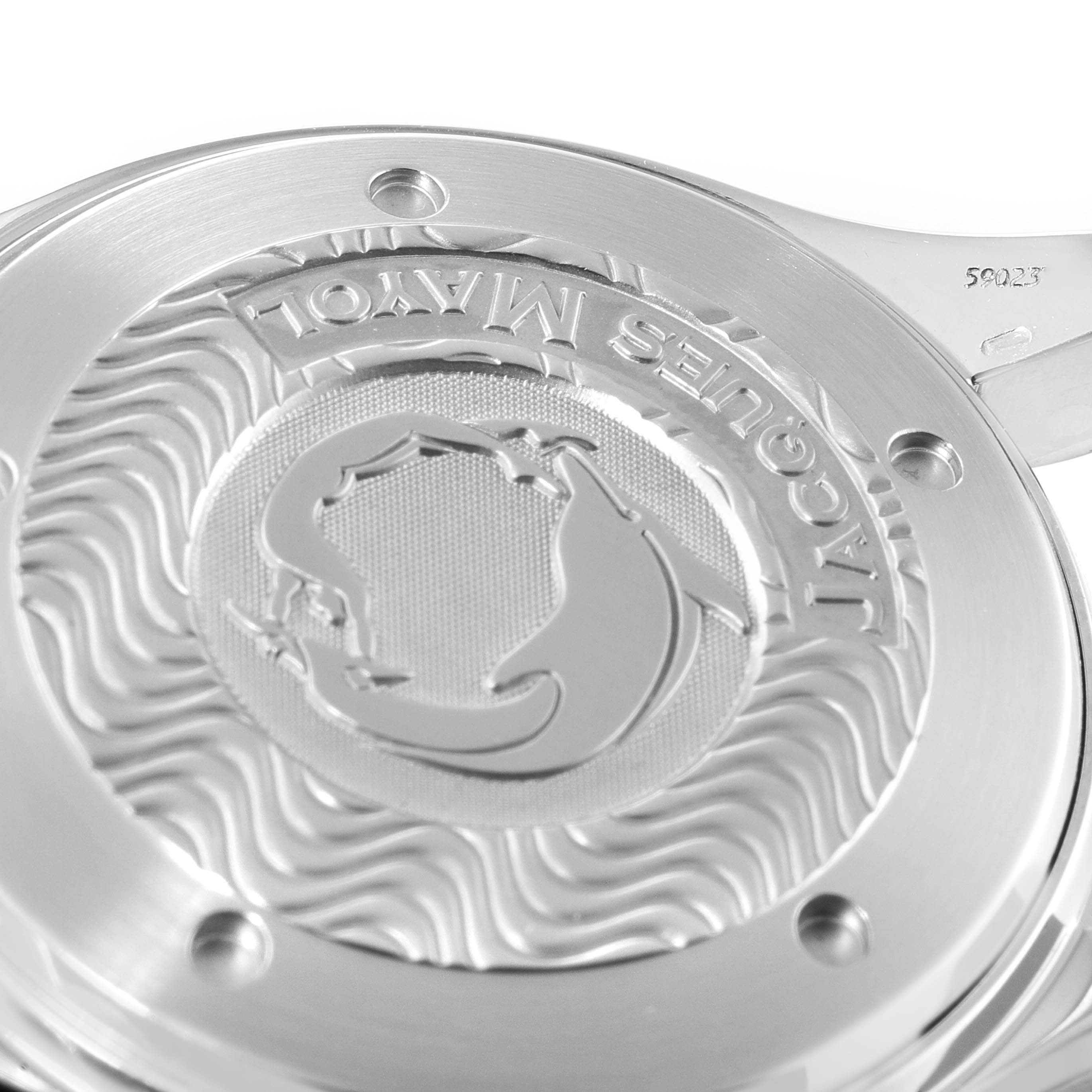 The image shows the engraved case back of an Omega Seamaster 2595.50.00 Men's Stainless Steel Black Dial 2595.50.00 Men's Stainless Steel Black Dial watch, featuring intricate designs and branding.