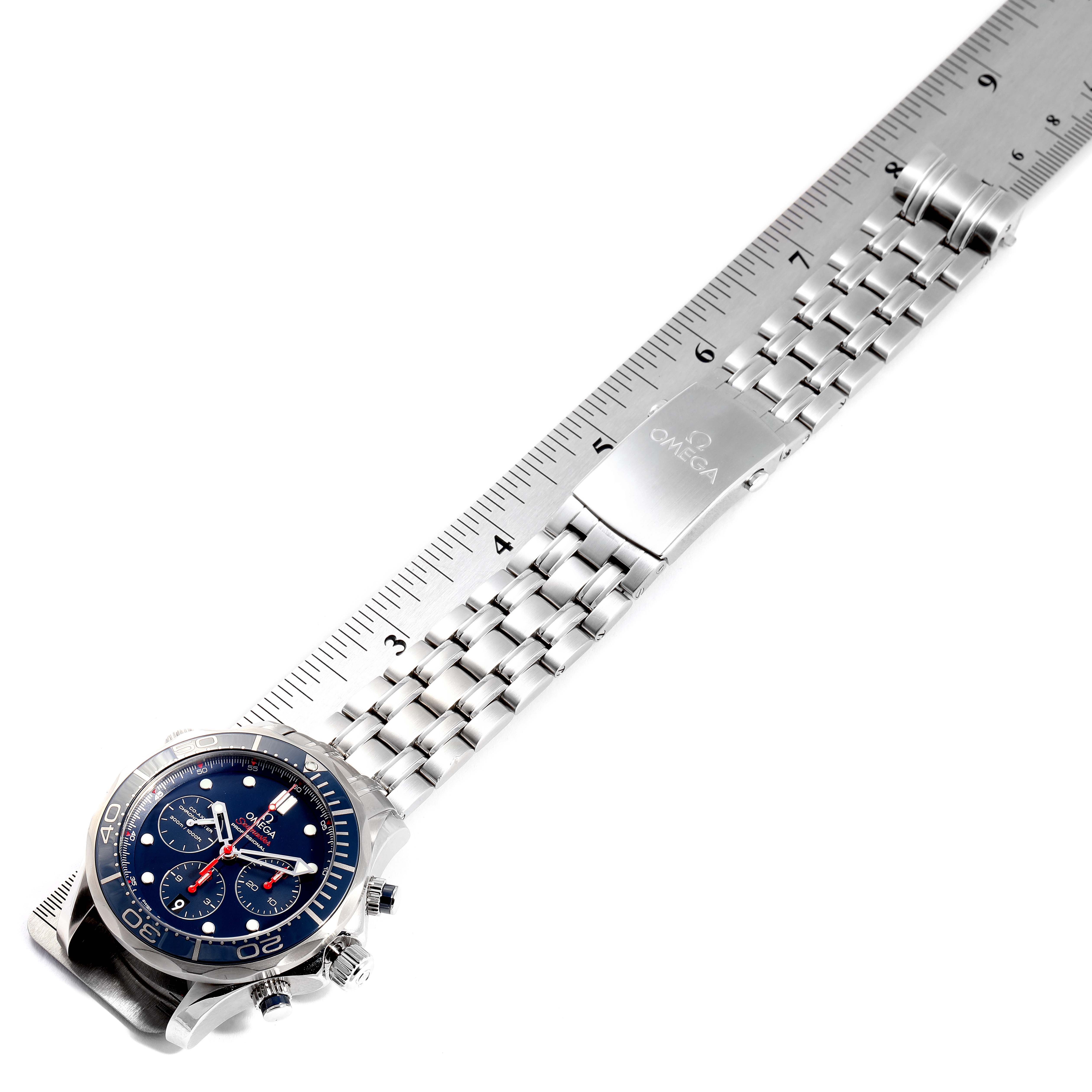 The image shows an Omega Seamaster 212.30.44.50.03.001 Men
s Stainless Steel Blue Dial 212.30.44.50.03.001 Men
s Stainless Steel Blue Dial watch laid flat with its stainless steel bracelet and clasp, measured against a ruler.