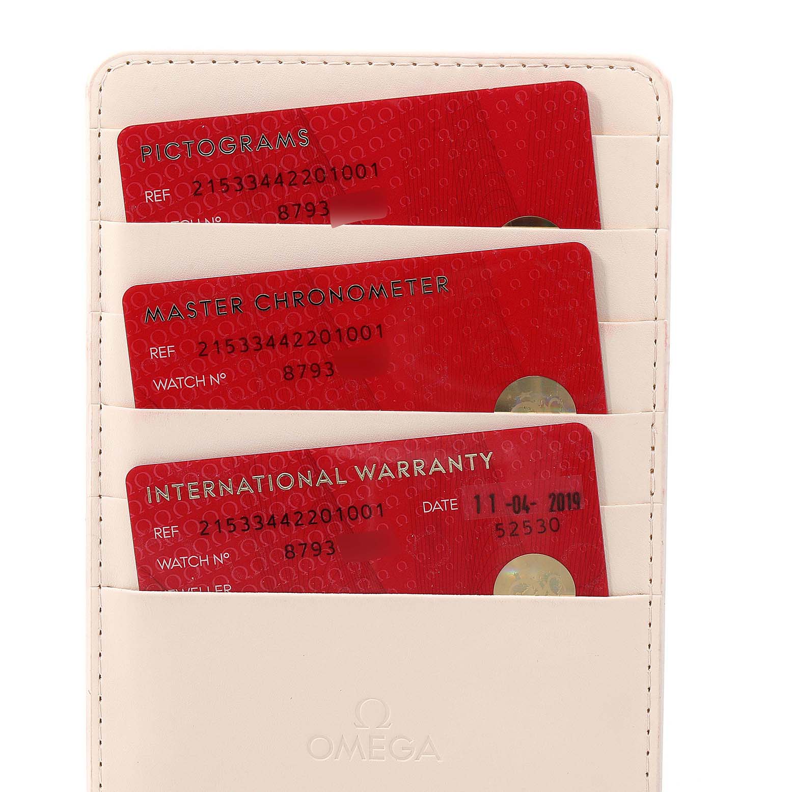 The image shows warranty, chronometer, and pictogram cards for the Omega Planet Ocean 215.33.44.22.03.001 Men's Stainless Steel Black Dial 215.33.44.22.03.001 Men's Stainless Steel Black Dial model from a top-down angle.