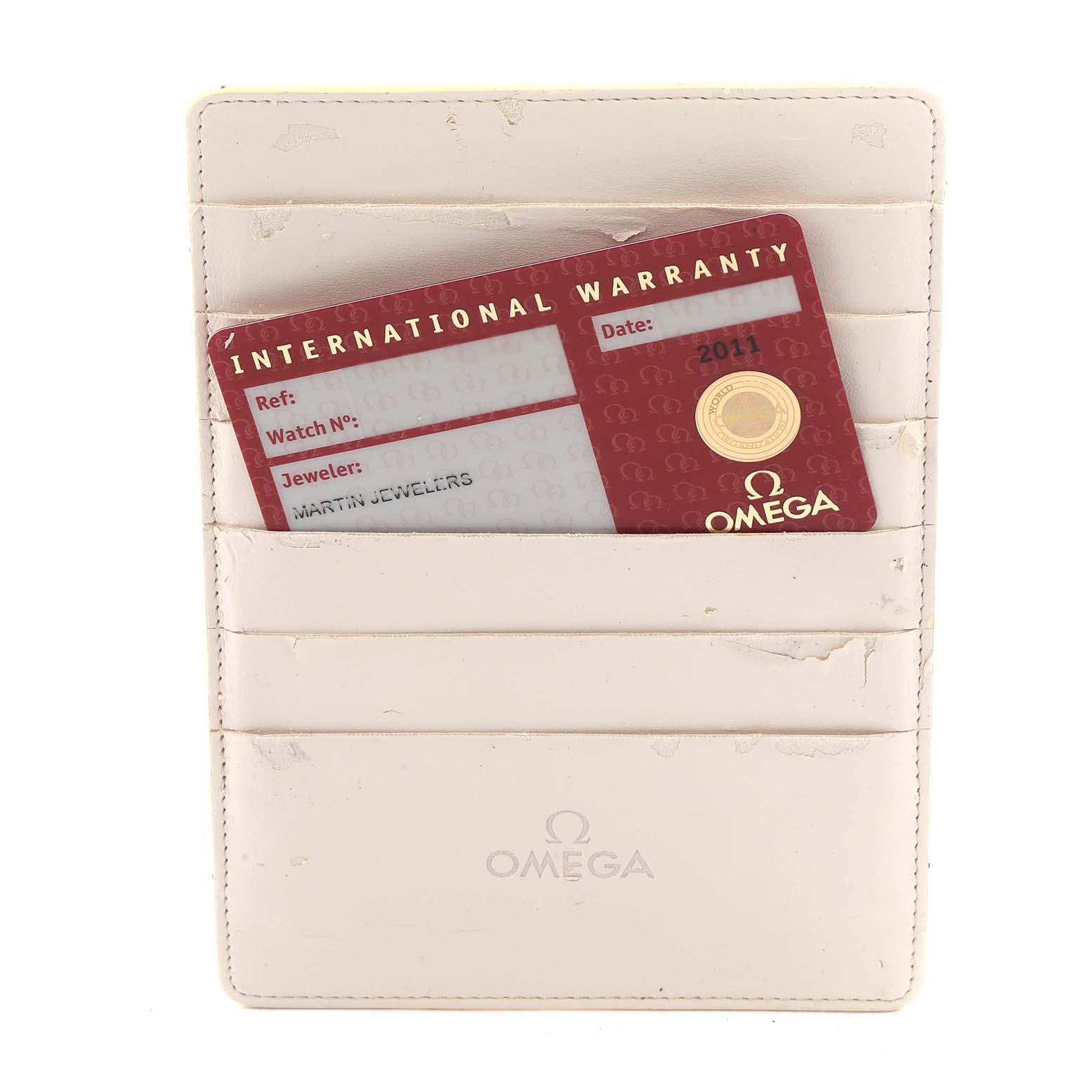 This image shows an International Warranty card for an Omega Seamaster 212.30.44.50.01.002 Men's Stainless Steel Black Dial 212.30.44.50.01.002 Men's Stainless Steel Black Dial, inside a branded cardholder.