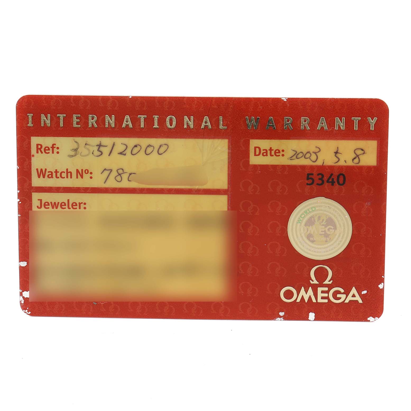 An Omega Speedmaster 3551.20.00 Men's Stainless Steel White Dial 3551.20.00 Men's Stainless Steel White Dial warranty card is shown at a top-down angle with details including reference number and date visible.