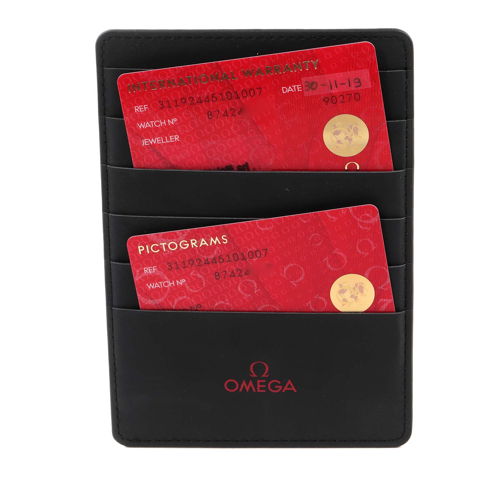 The image shows a close-up of an Omega Speedmaster 311.92.44.51.01.007 Men's Ceramic Black Dial 311.92.44.51.01.007 Men's Ceramic Black Dial watch's warranty card and pictograms card in a black cardholder.