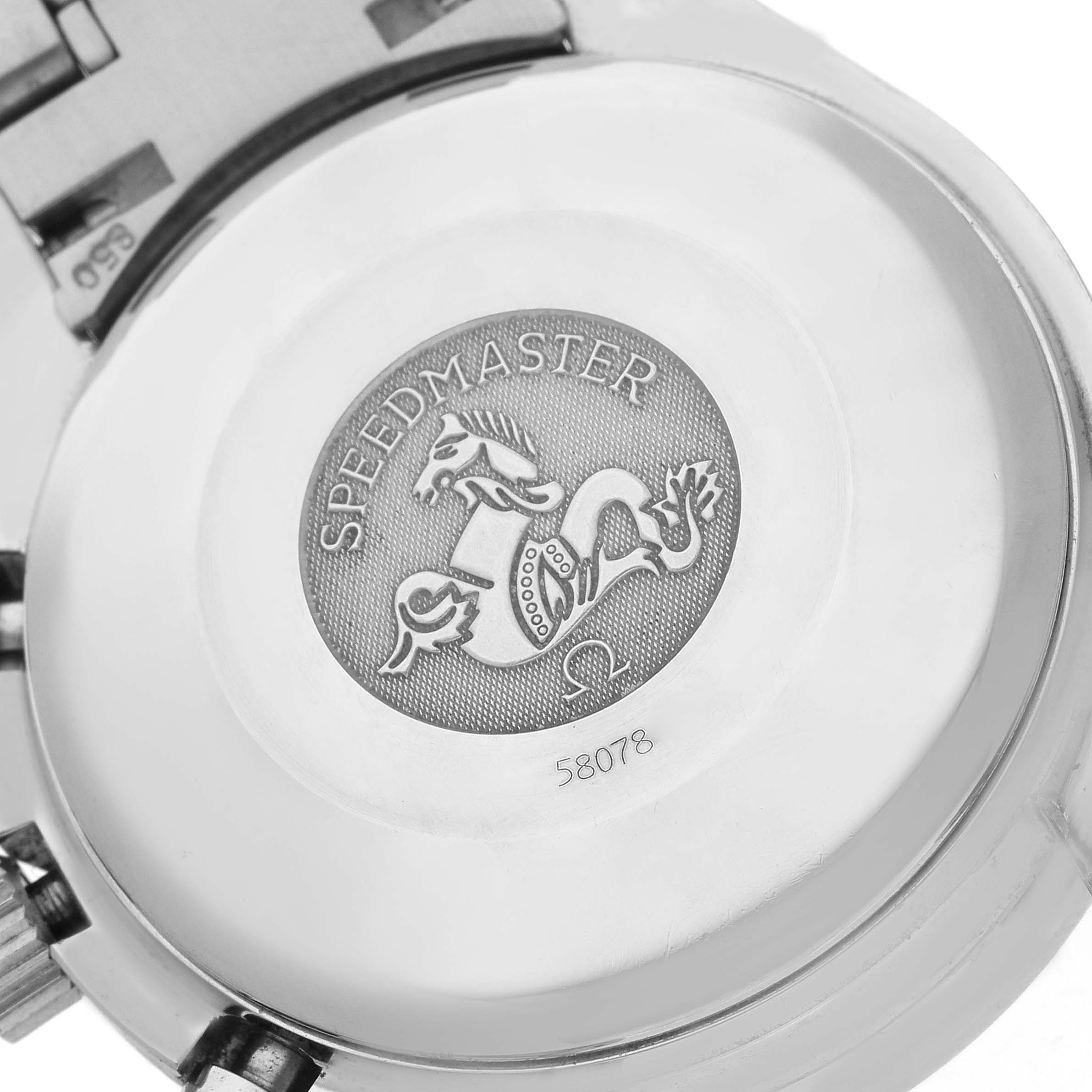 The image shows the back case of the Omega Speedmaster 3523.80.00 Men's Stainless Steel Blue Dial 3523.80.00 Men's Stainless Steel Blue Dial, displaying the engraved logo and markings.