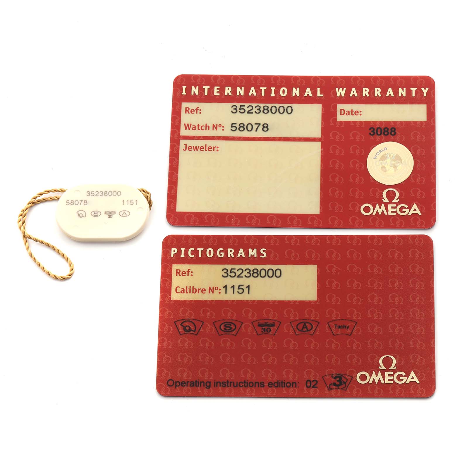 The image shows Omega Speedmaster 3523.80.00 Men's Stainless Steel Blue Dial 3523.80.00 Men's Stainless Steel Blue Dial's warranty card, pictogram card, and a tag, viewed from above.