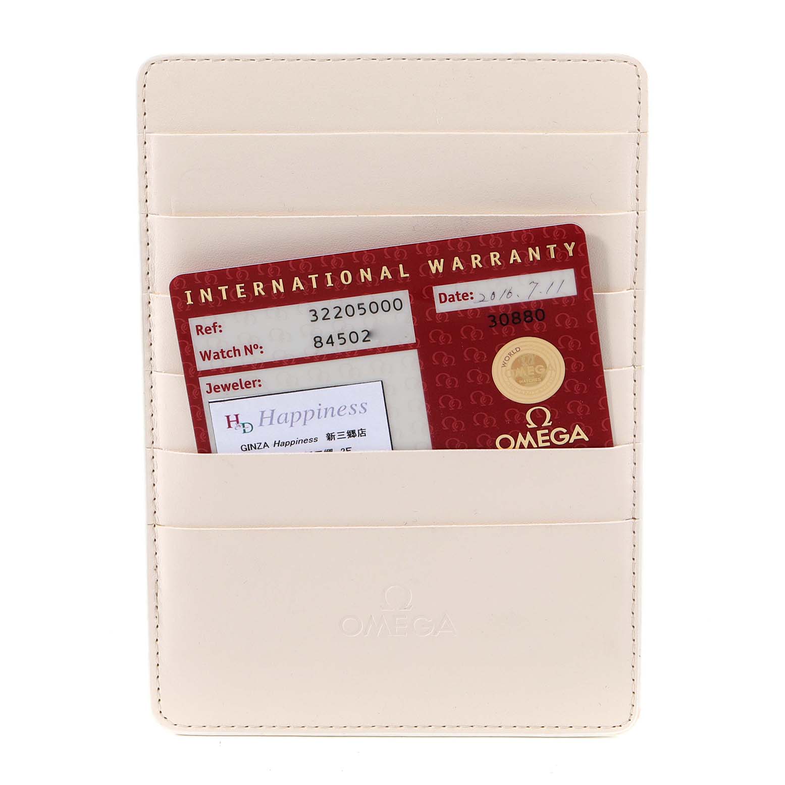 The image shows an Omega Speedmaster 3220.50.00 Men
s Stainless Steel Black Dial 3220.50.00 Men
s Stainless Steel Black Dial international warranty card placed in a leather holder.