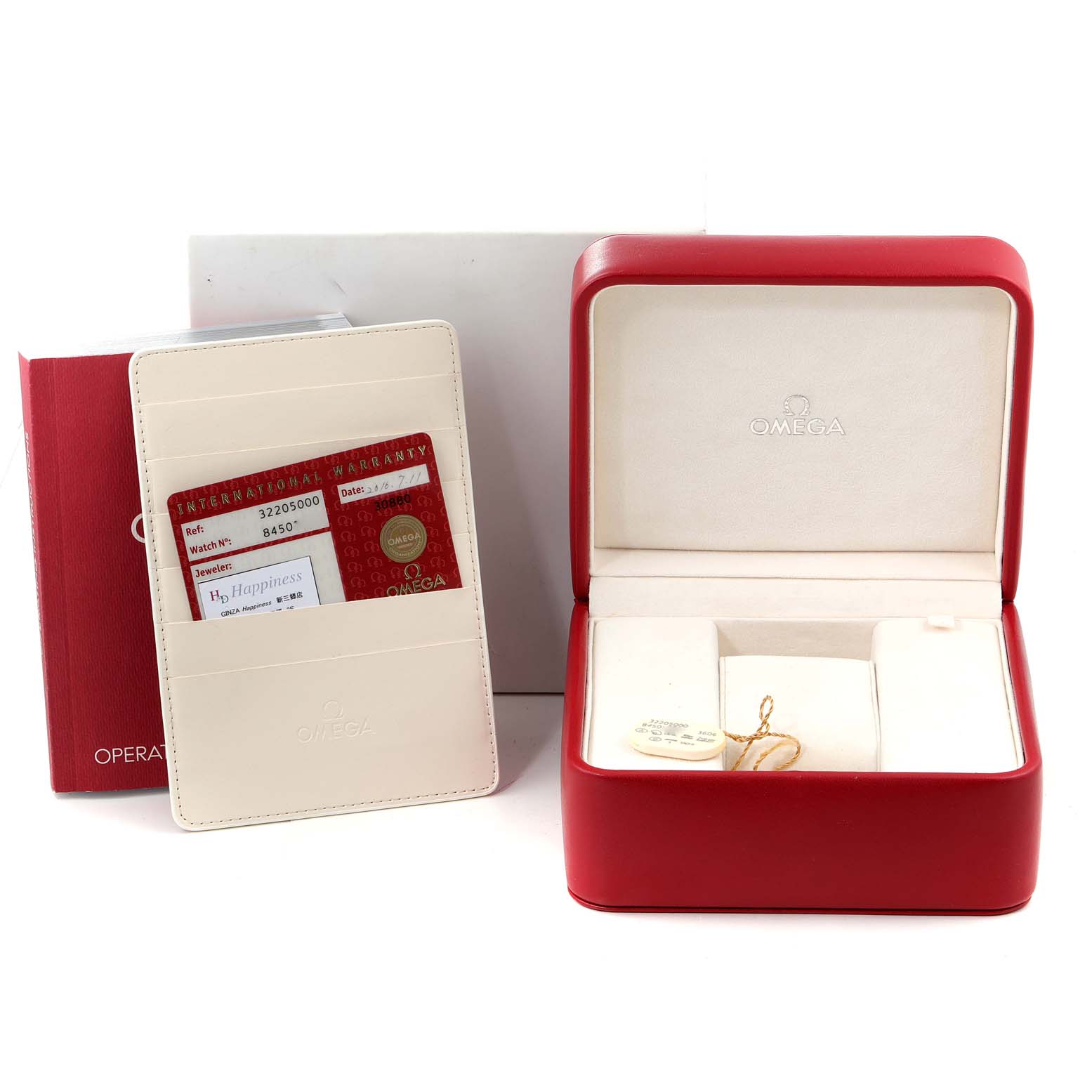 The image shows the box and warranty cards for the Omega Speedmaster 3220.50.00 Men
s Stainless Steel Black Dial 3220.50.00 Men
s Stainless Steel Black Dial watch, along with a red operation manual.