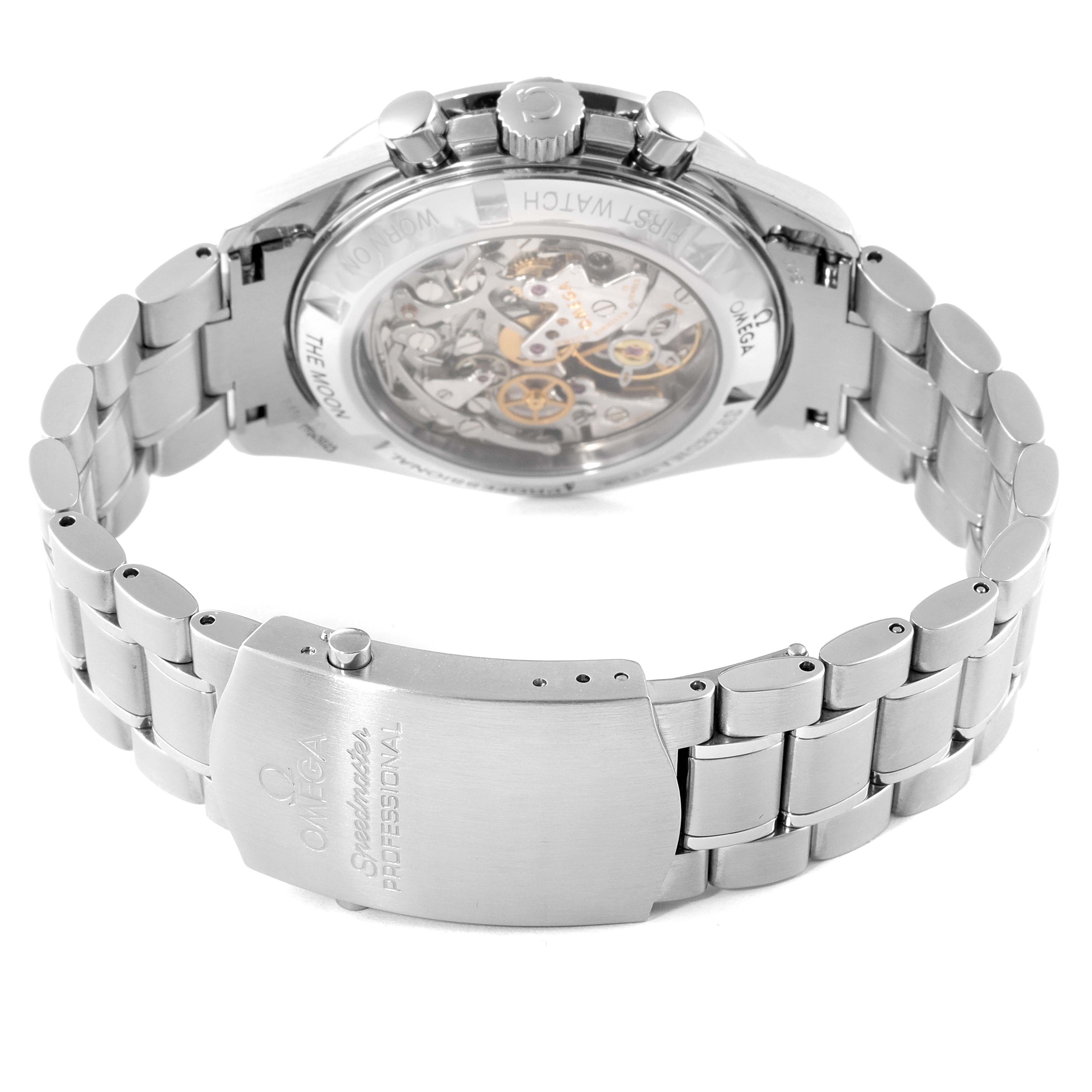 The image shows the back of an Omega Speedmaster 3572.50.00 Men
s Stainless Steel Black Dial 3572.50.00 Men
s Stainless Steel Black Dial watch, highlighting its open case back, movement, and part of its bracelet clasp.