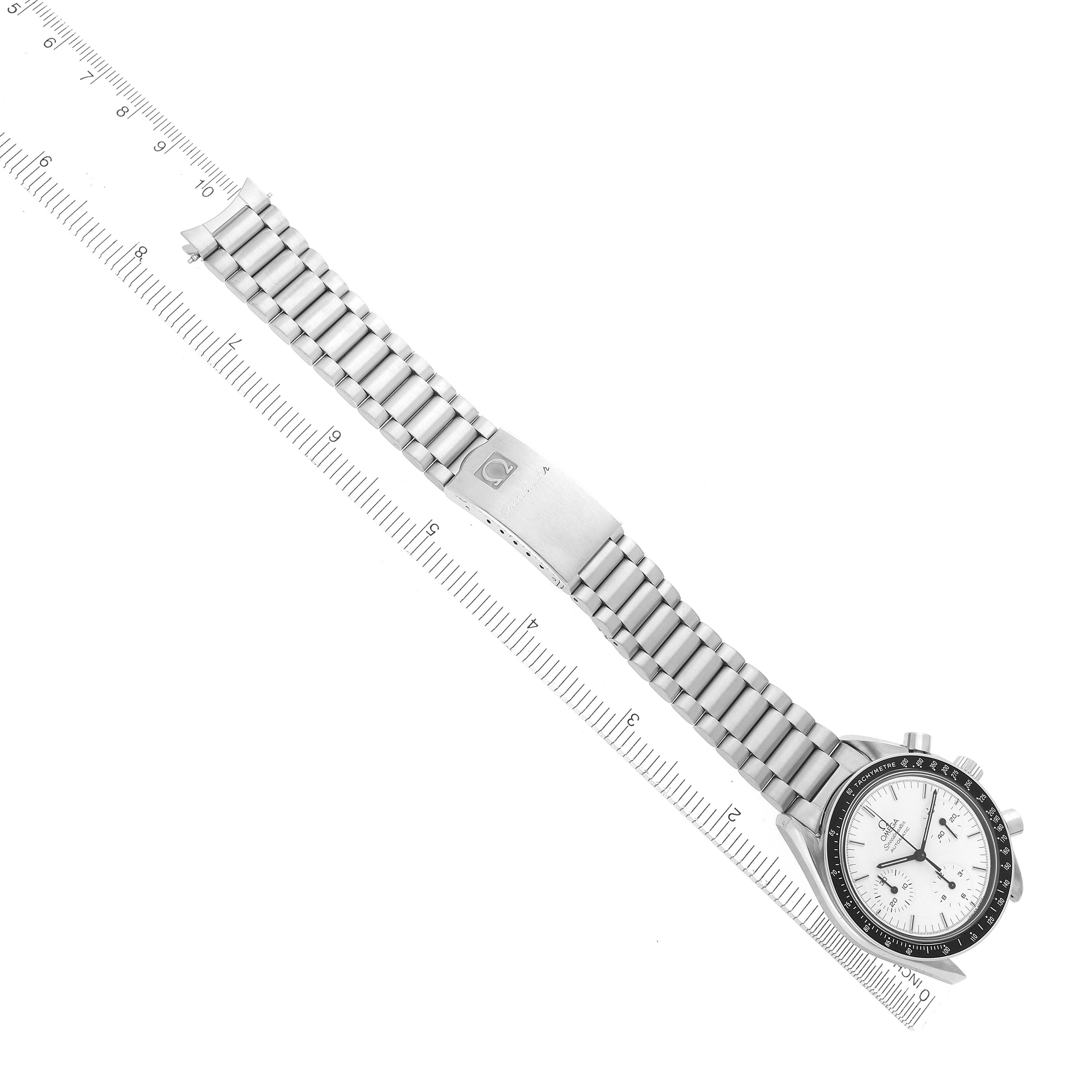 The Omega Speedmaster 3510.20.00 Men's Stainless Steel White Dial 3510.20.00 Men's Stainless Steel White Dial watch is shown from an overhead angle, displaying the dial, bezel, and full metal bracelet alongside a ruler.