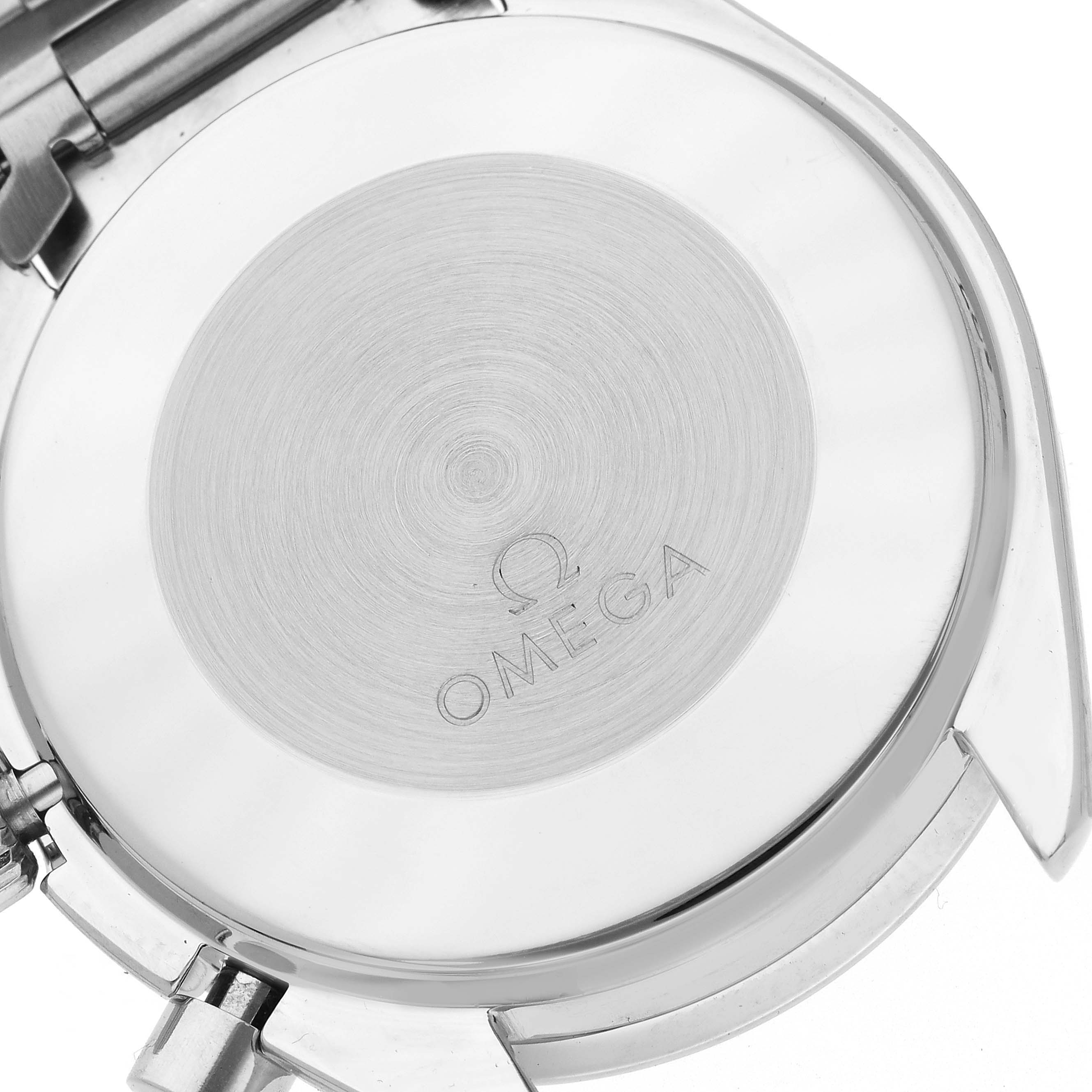The image shows the back of the Omega Speedmaster 3510.20.00 Men's Stainless Steel White Dial 3510.20.00 Men's Stainless Steel White Dial watch, highlighting the engraved logo and case back details.