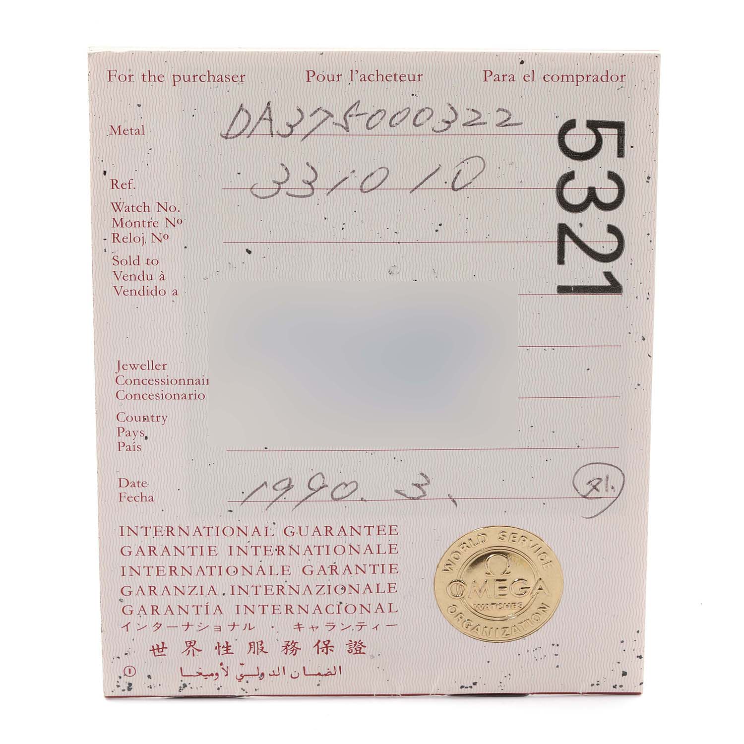This image shows the international guarantee card for an Omega Speedmaster 3310.10.00 Men's Steel and Gold (two tone) Champagne Dial 3310.10.00 Men's Steel and Gold (two tone) Champagne Dial watch from a front angle.