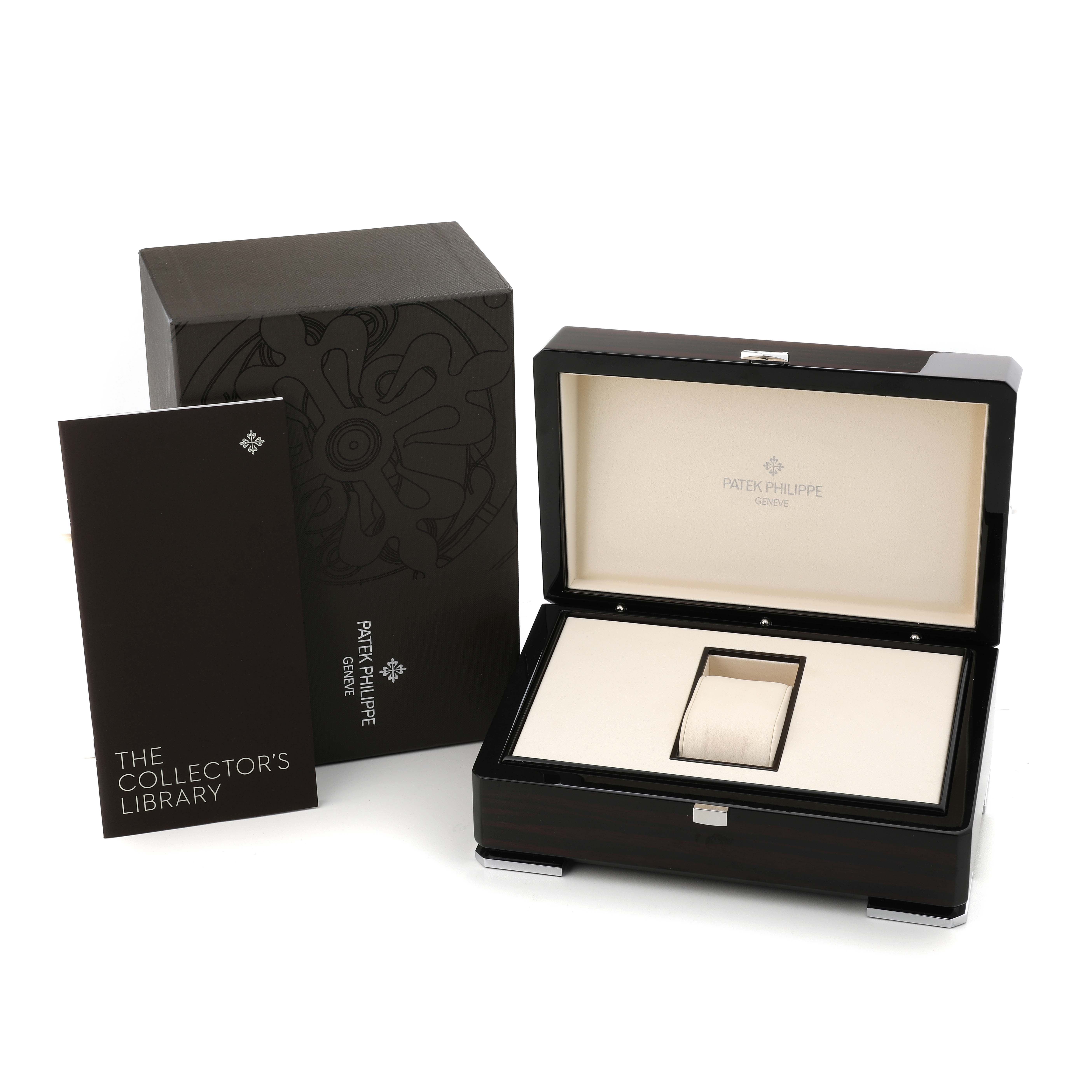 The image shows a Patek Philippe Complications 5960P-001 Men's Platinum Silver Dial watch box, a manual or booklet, and an outer protective case from a slightly elevated angle.