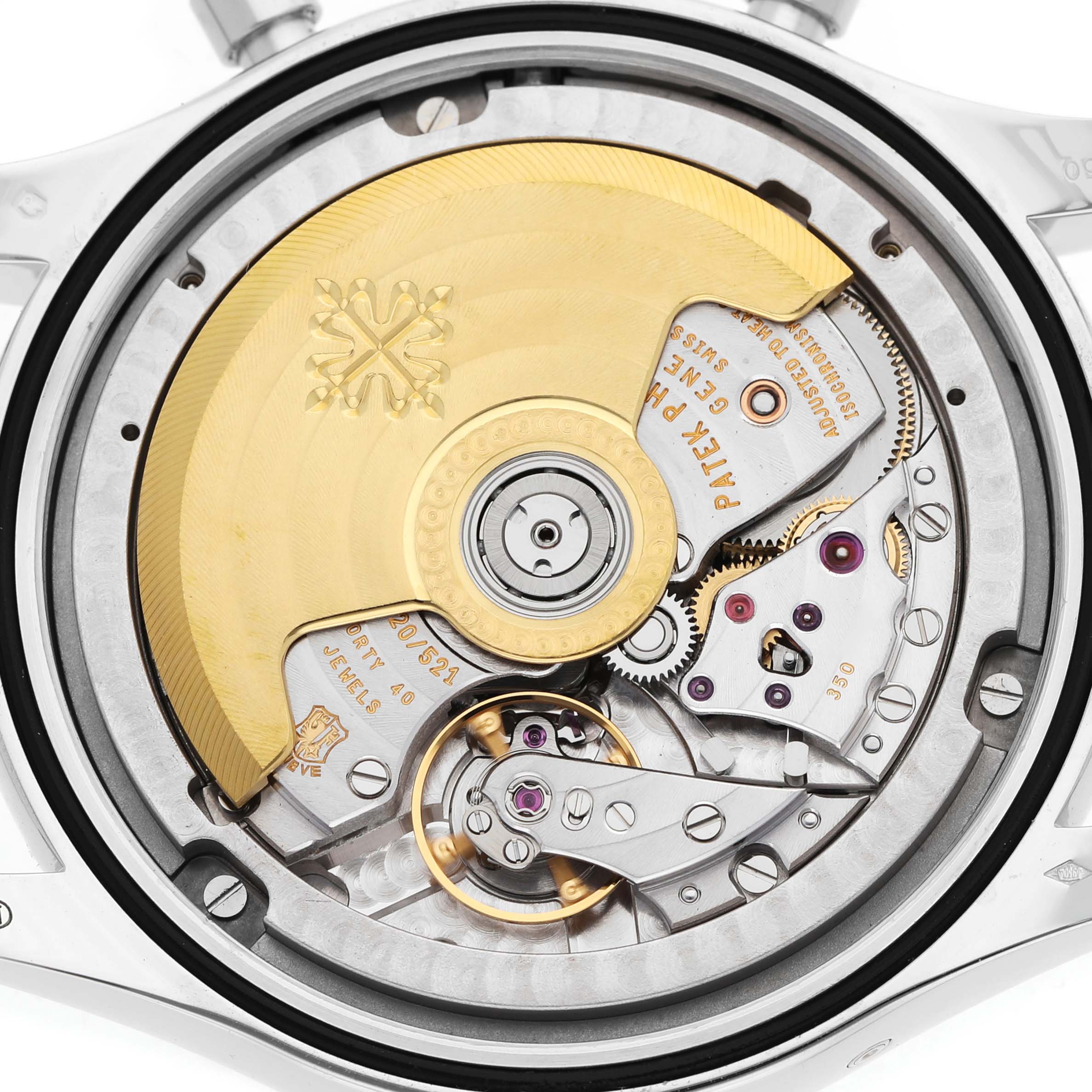 The image shows the movement of a Patek Philippe Complications 5960P-001 Men's Platinum Silver Dial watch from a back angle, highlighting the rotor and intricate mechanics.