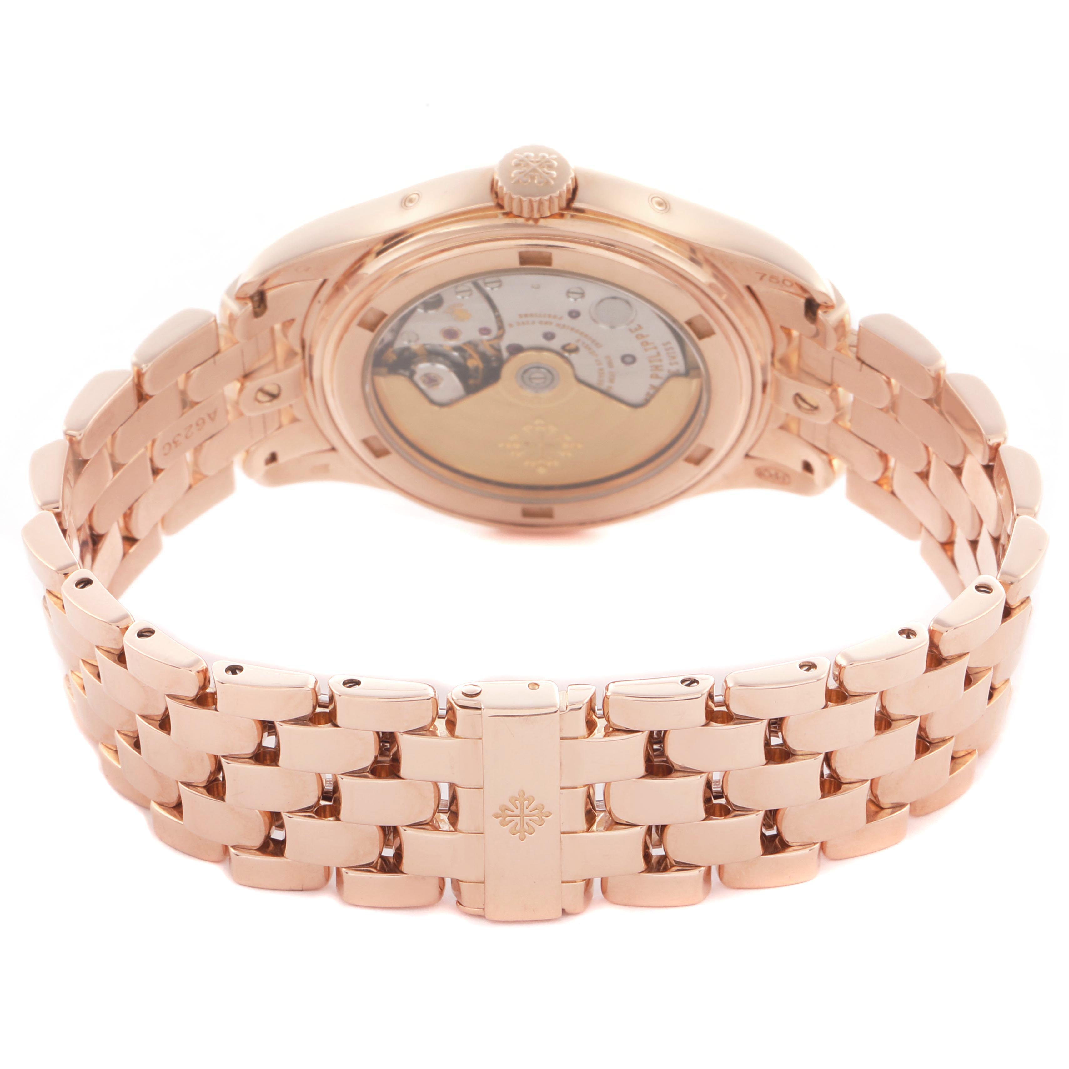 The Patek Philippe Complications 5036/1R Men's Rose Gold White Dial 5036/1R Men's Rose Gold White Dial watch is shown from the back with an exposed movement and intricate bracelet design.