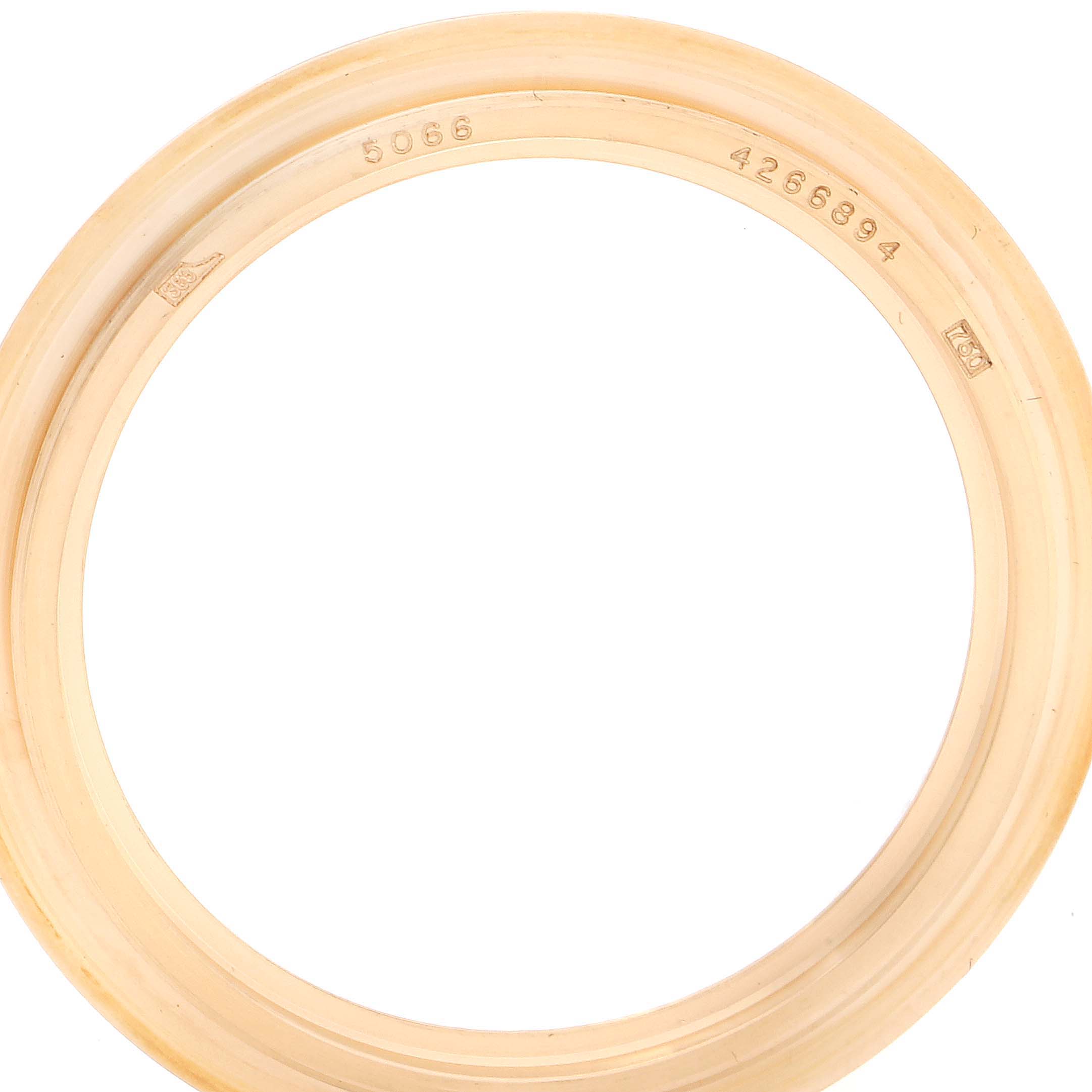 This image shows a close-up of the outer bezel ring of a Patek Philippe Aquanaut 5066J Men's Yellow Gold Black Dial 5066J Men's Yellow Gold Black Dial watch.