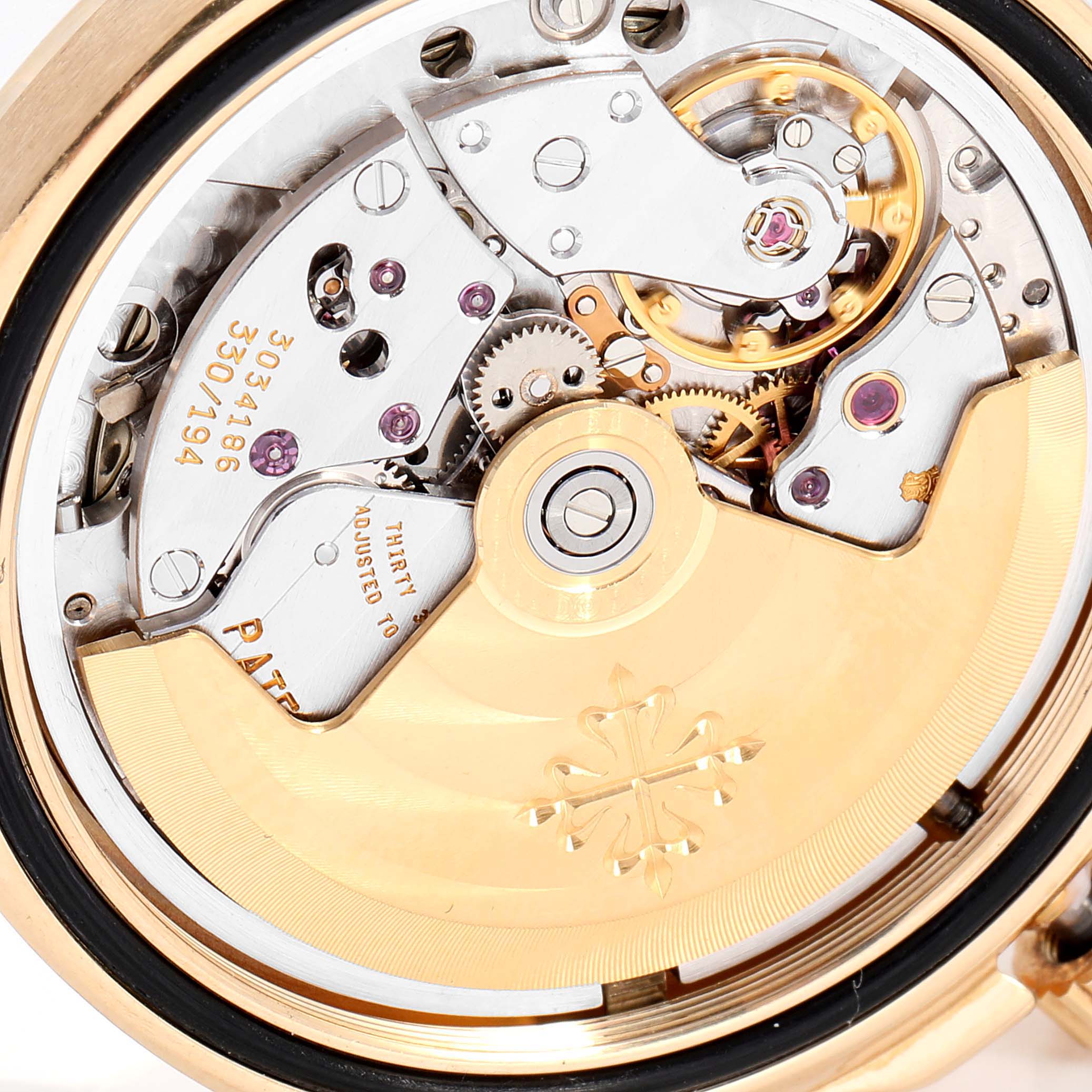 The image shows a close-up view of the movement mechanism of the Patek Philippe Aquanaut 5066J Men's Yellow Gold Black Dial 5066J Men's Yellow Gold Black Dial watch.