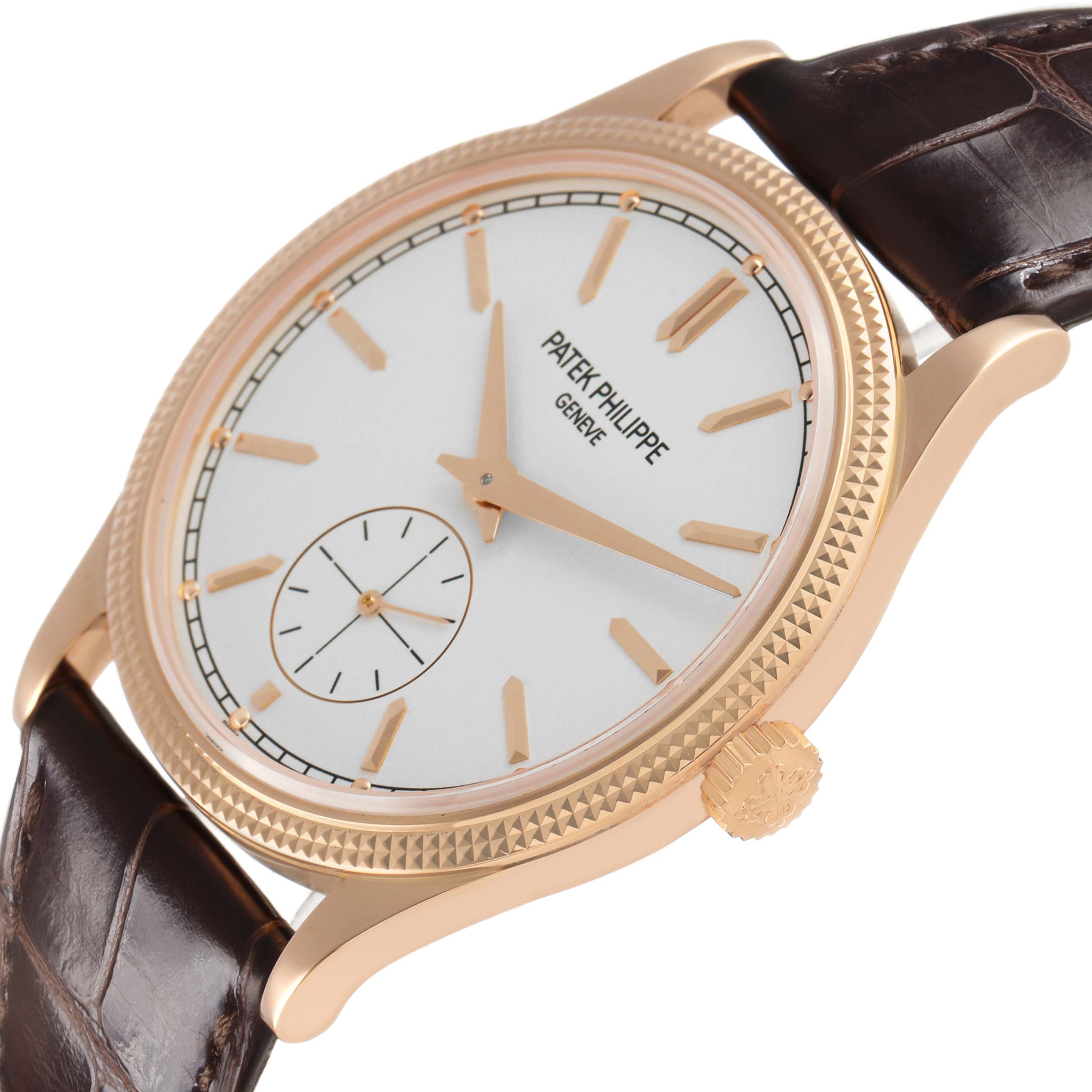 The Patek Philippe Calatrava 6119 6119R Men's Rose Gold Silver Dial watch is shown at an angle highlighting the gold case, crown, white dial, indices, and leather strap.