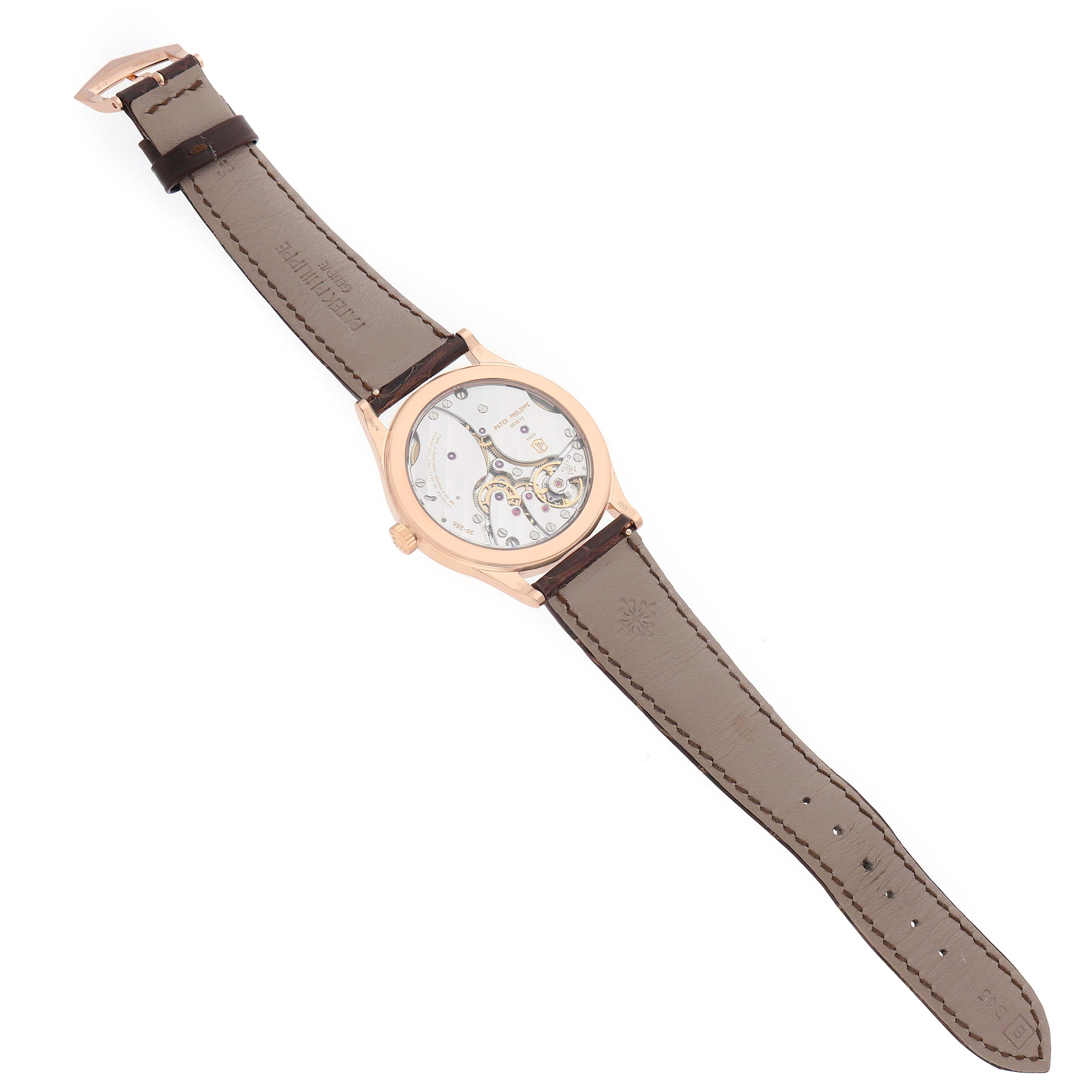 The Patek Philippe Calatrava 6119 6119R Men's Rose Gold Silver Dial watch is shown from the back, displaying its movement and leather strap.