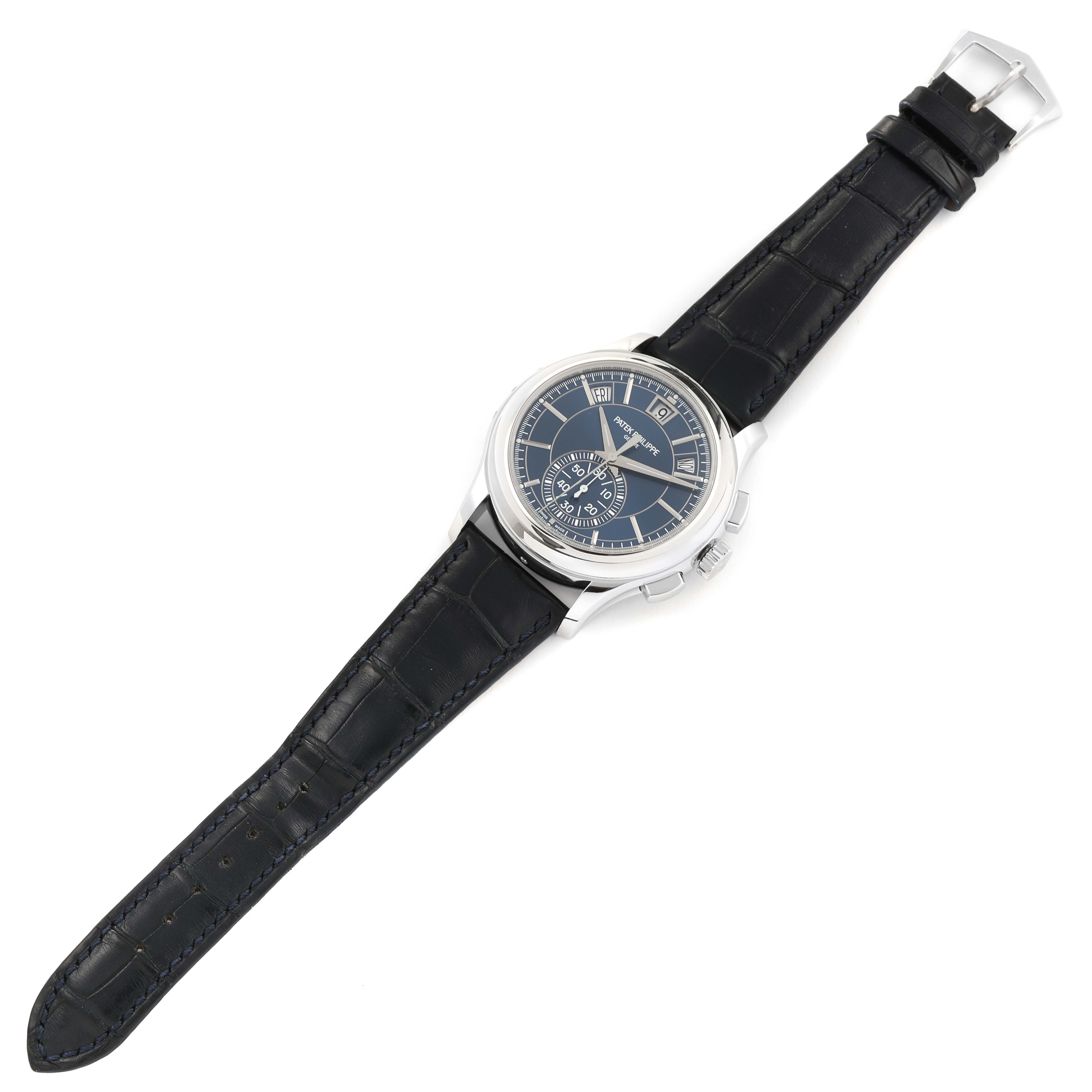 The Patek Philippe Complications 5905P - 001 Men's Platinum Blue Dial 5905P - 001 Men's Platinum Blue Dial watch is shown from an overhead angle, displaying its face and black leather strap.