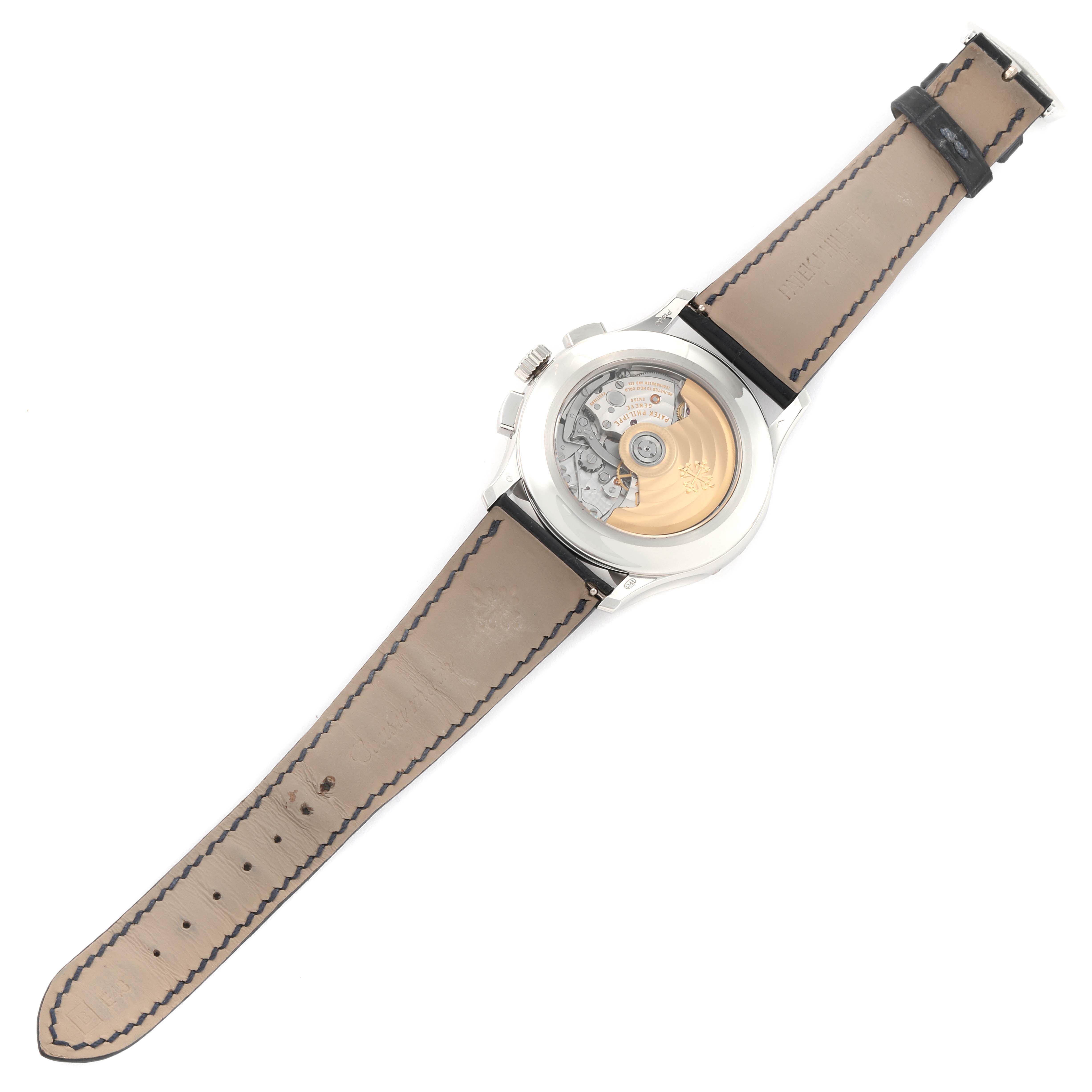 The image shows the back view of the Patek Philippe Complications 5905P - 001 Men's Platinum Blue Dial 5905P - 001 Men's Platinum Blue Dial model, highlighting its movement and transparent case back.