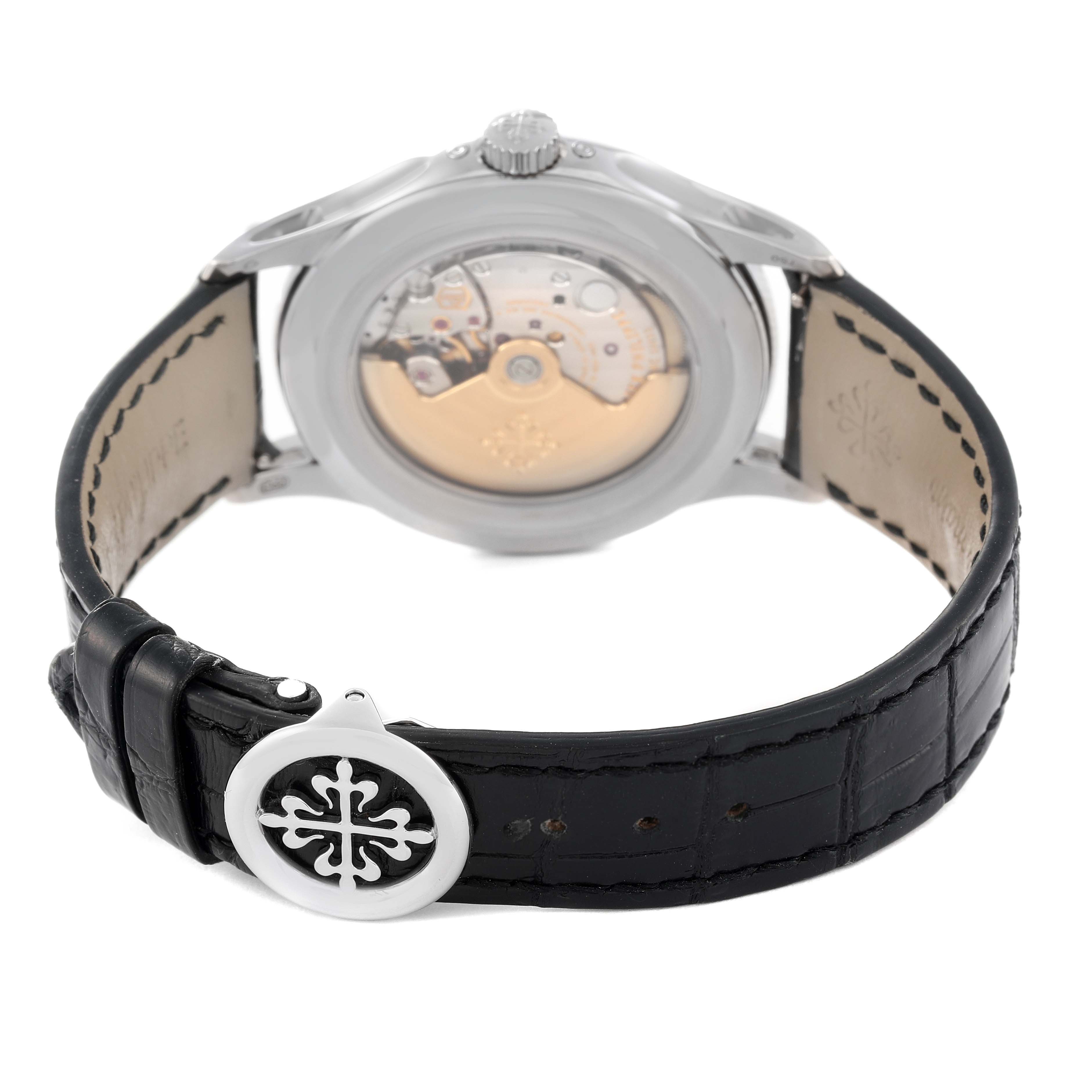 This image shows the back case and leather strap of a Patek Philippe Complications 5205G - 010 Men's White Gold Grey Dial 5205G - 010 Men's White Gold Grey Dial model, featuring the movement mechanism and clasp.