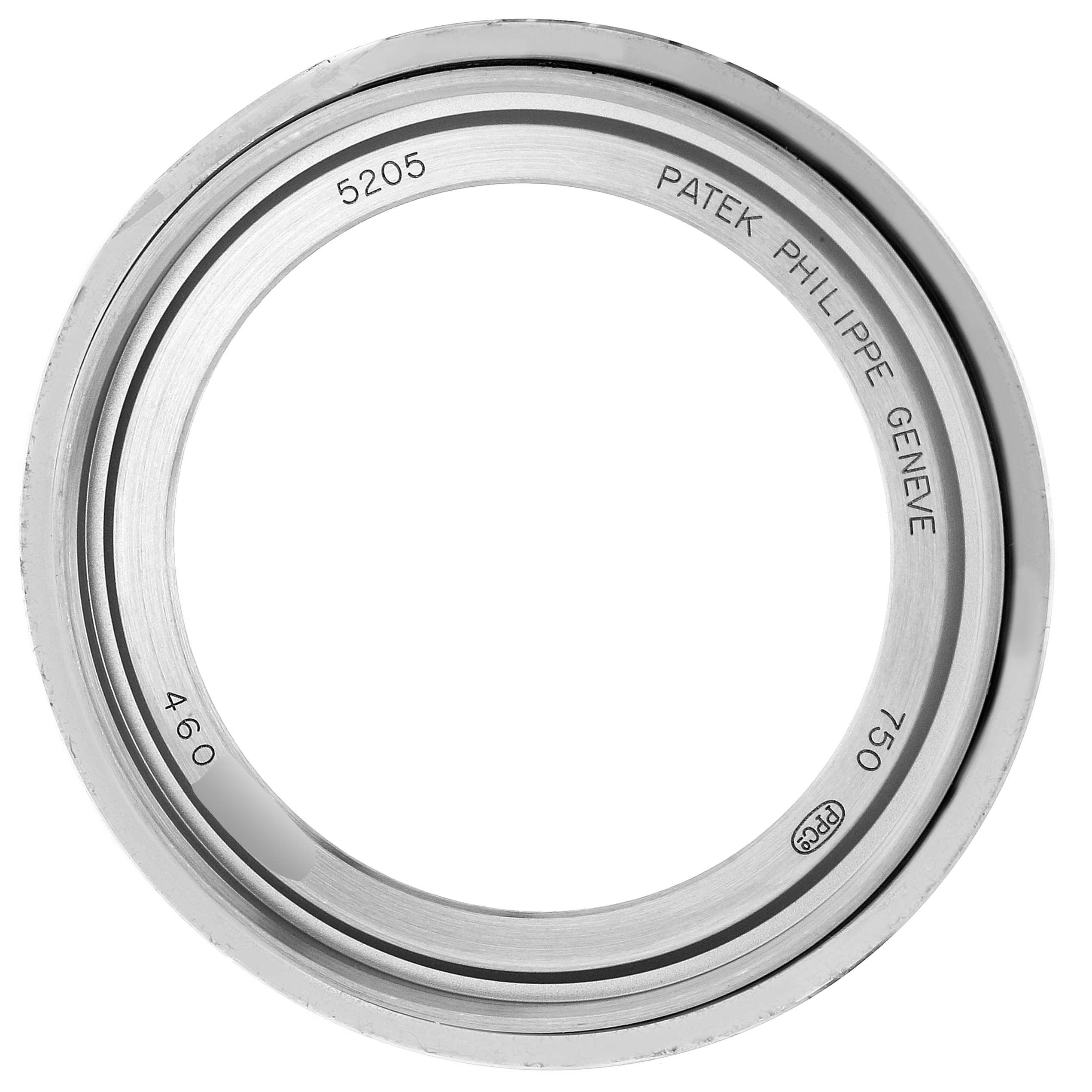 The image shows a close-up of the bezel of a Patek Philippe Complications 5205G - 010 Men's White Gold Grey Dial 5205G - 010 Men's White Gold Grey Dial model 5205.