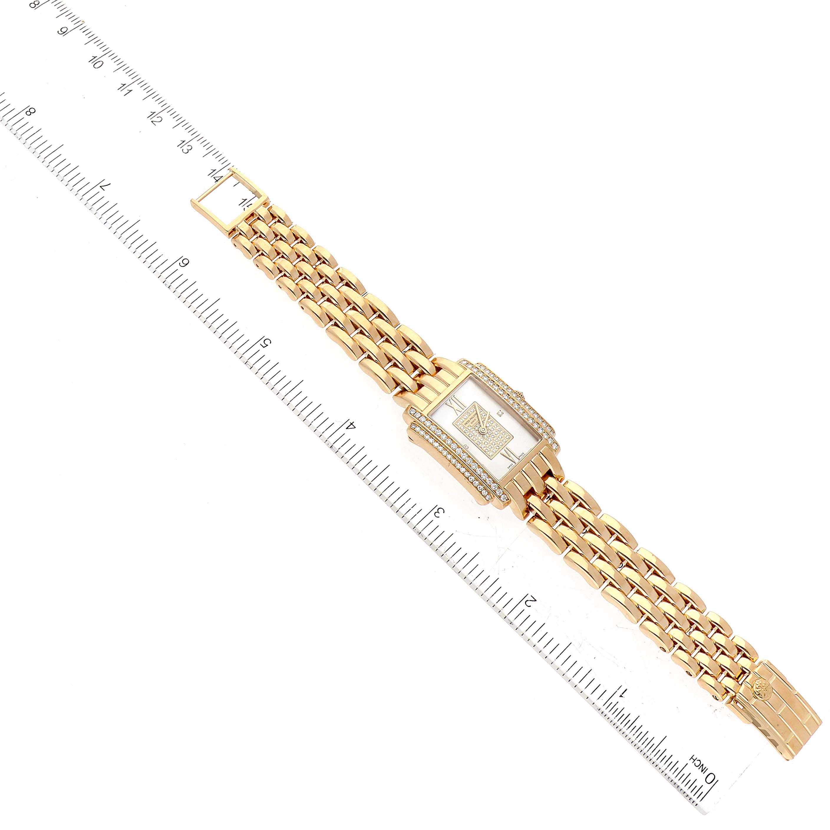 The image shows a Patek Philippe Gondolo 4825/101J-001 Women's Yellow Gold Mother of Pearl Dial 4825/101J-001 Women's Yellow Gold Mother of Pearl Dial watch, positioned flat with a ruler beside it for scale.