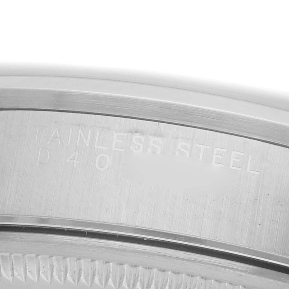 The image shows a close-up of the stainless steel case back of a Rolex Air-King 14000M Men's Stainless Steel Silver Dial 14000M Men's Stainless Steel Silver Dial watch, highlighting the brushed metal finish.