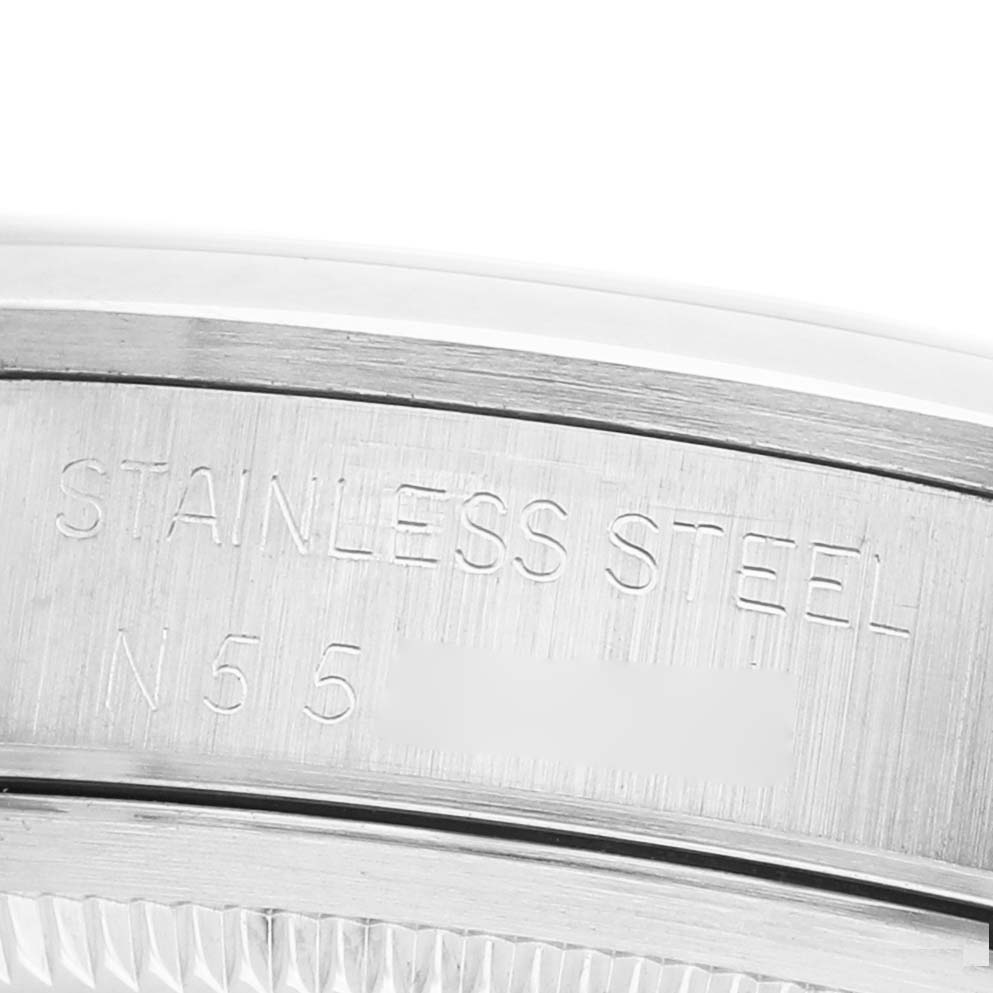 The image shows a close-up of the stainless steel caseback edge of a Rolex Air-King 14000 Men's Stainless Steel White Dial watch.