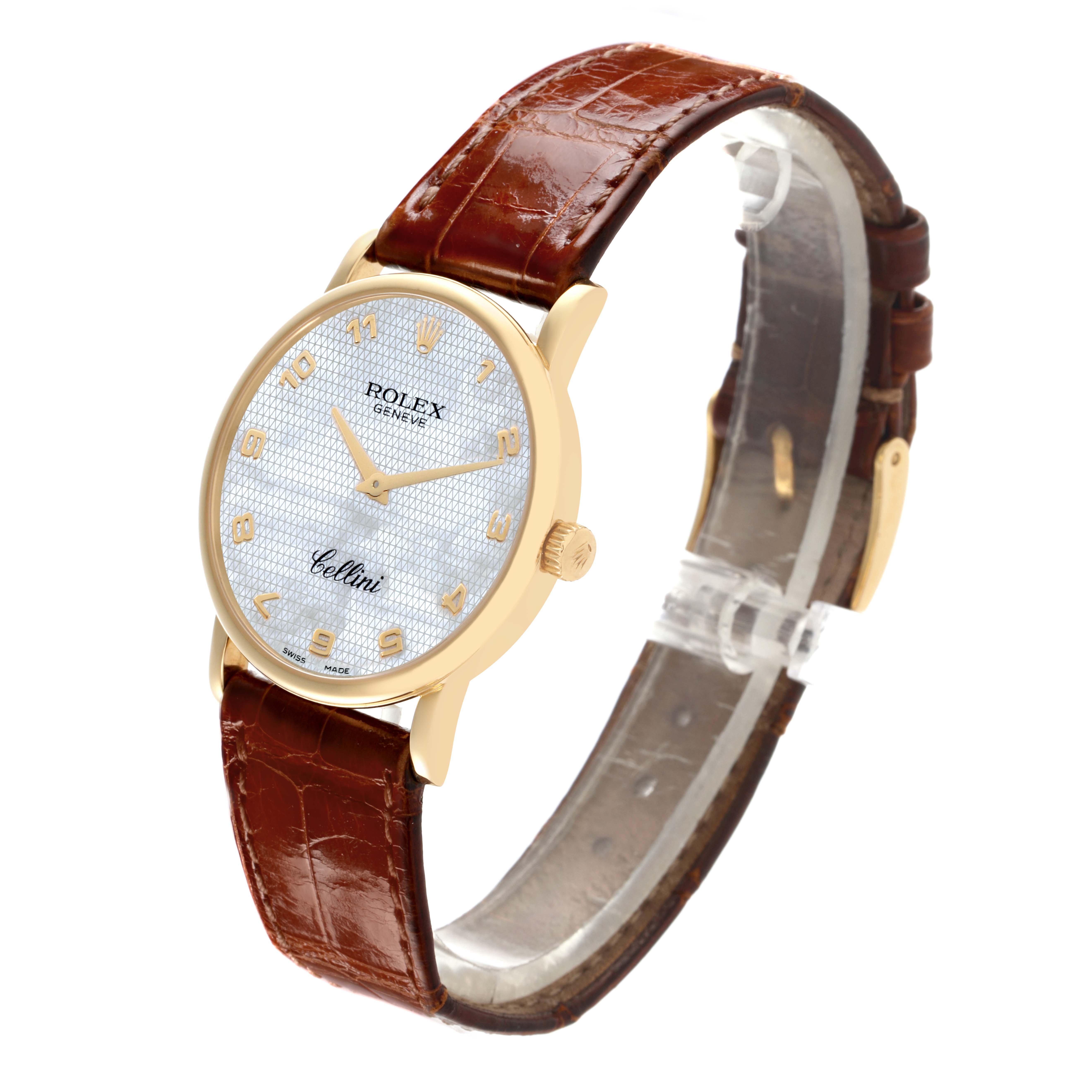 The Rolex Cellini 5115 Men's Yellow Gold Mother of Pearl Dial 5115 Men's Yellow Gold Mother of Pearl Dial watch is shown at a three-quarter angle, highlighting its brown leather strap, gold case, and textured dial.
