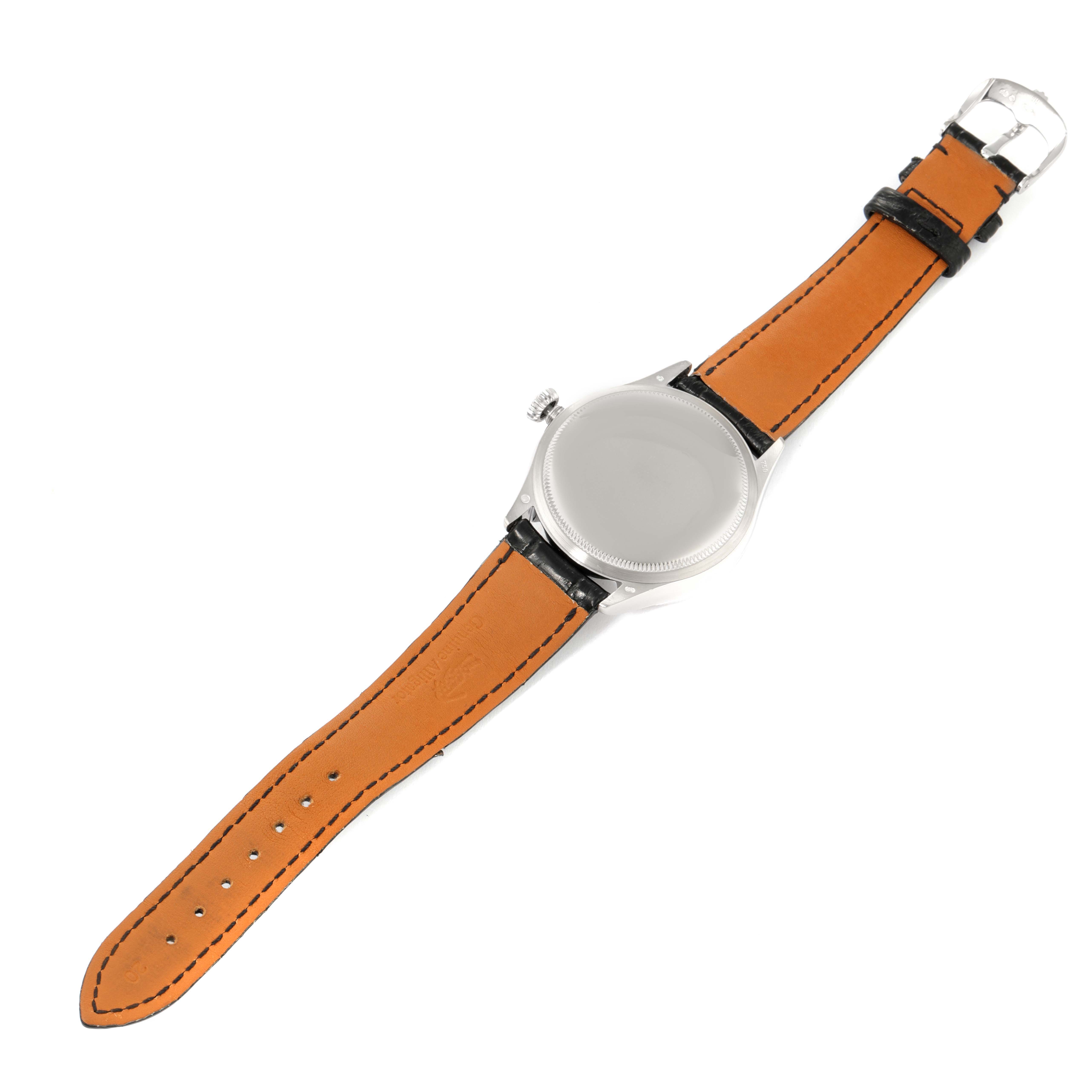 The image shows the back of a Rolex Cellini 50529 Men's White Gold Silver Dial 50529 Men's White Gold Silver Dial watch with its orange leather strap fully extended.