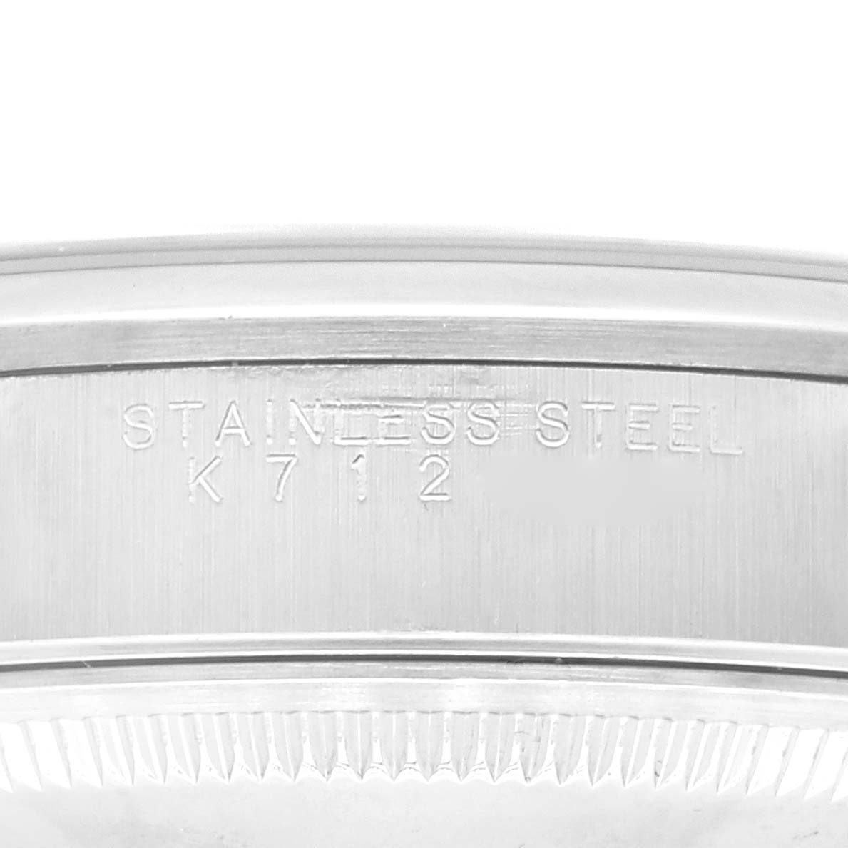 This image shows a close-up of the side engraving on a stainless steel bezel of a Rolex Date 15200 Men's Stainless Steel Black Dial 15200 Men's Stainless Steel Black Dial model watch.