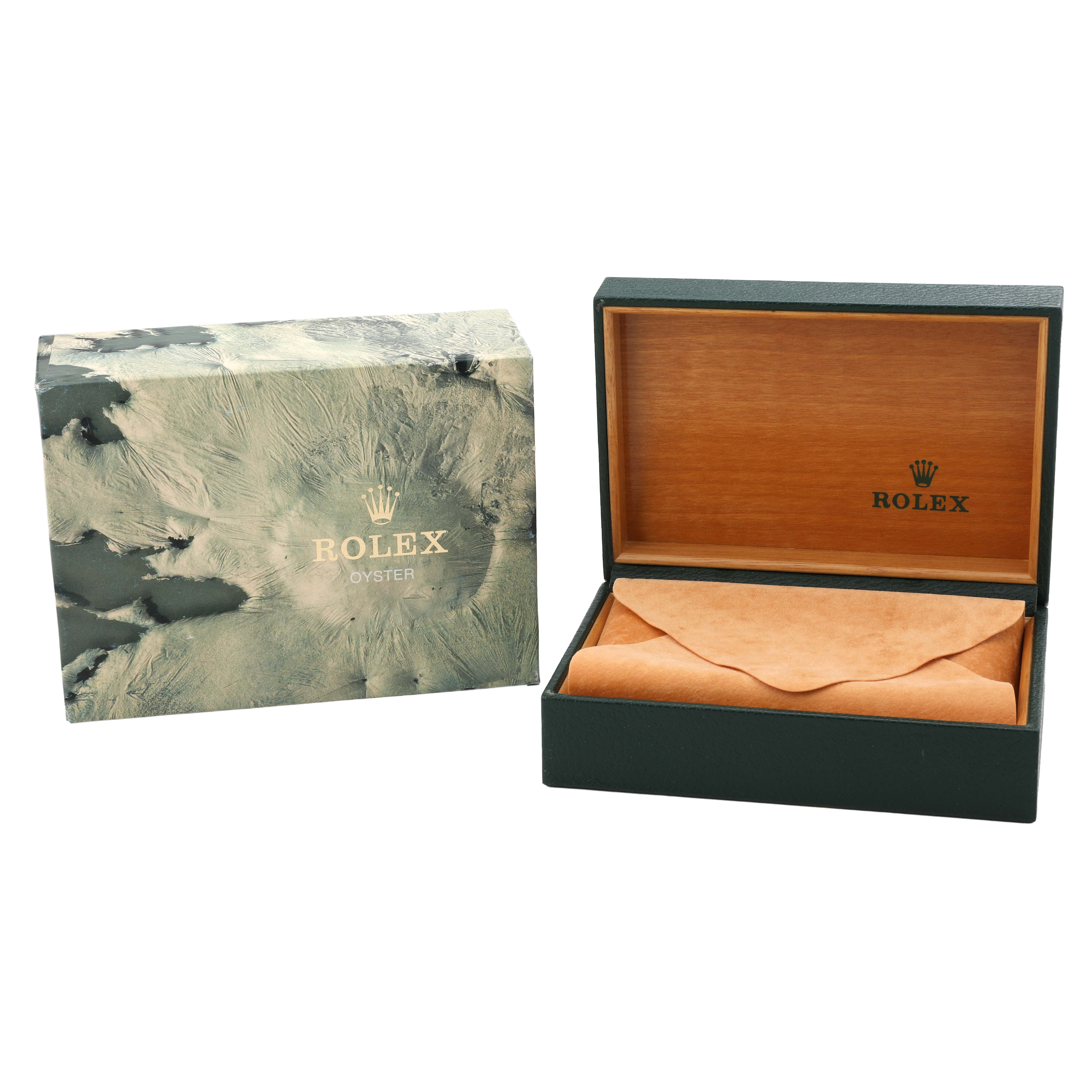 The image shows a Rolex Date 15223 Men's Steel and Gold (two tone) Champagne Dial model watch box and outer sleeve, with the interior lined in wood and a suede cloth inside.