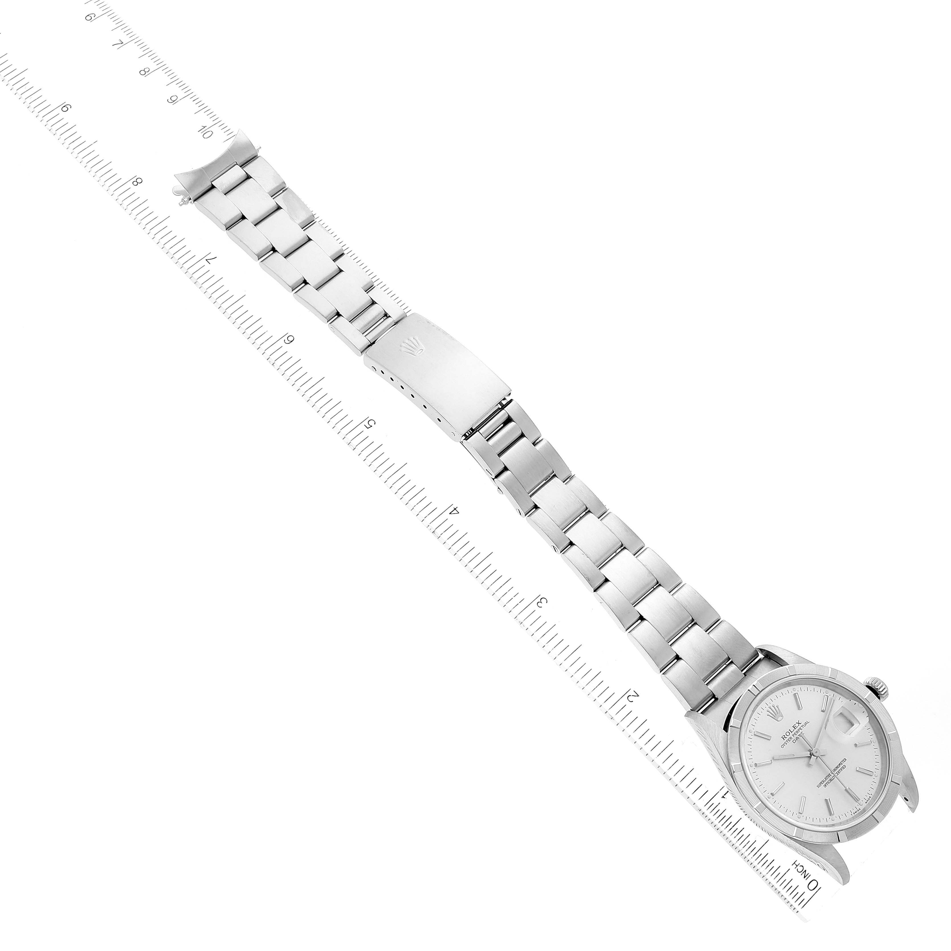 The image shows a top-down view of a Rolex Date 15210 Men
s Stainless Steel Silver Dial 15210 Men
s Stainless Steel Silver Dial model watch with a prominent metal bracelet and clasp.