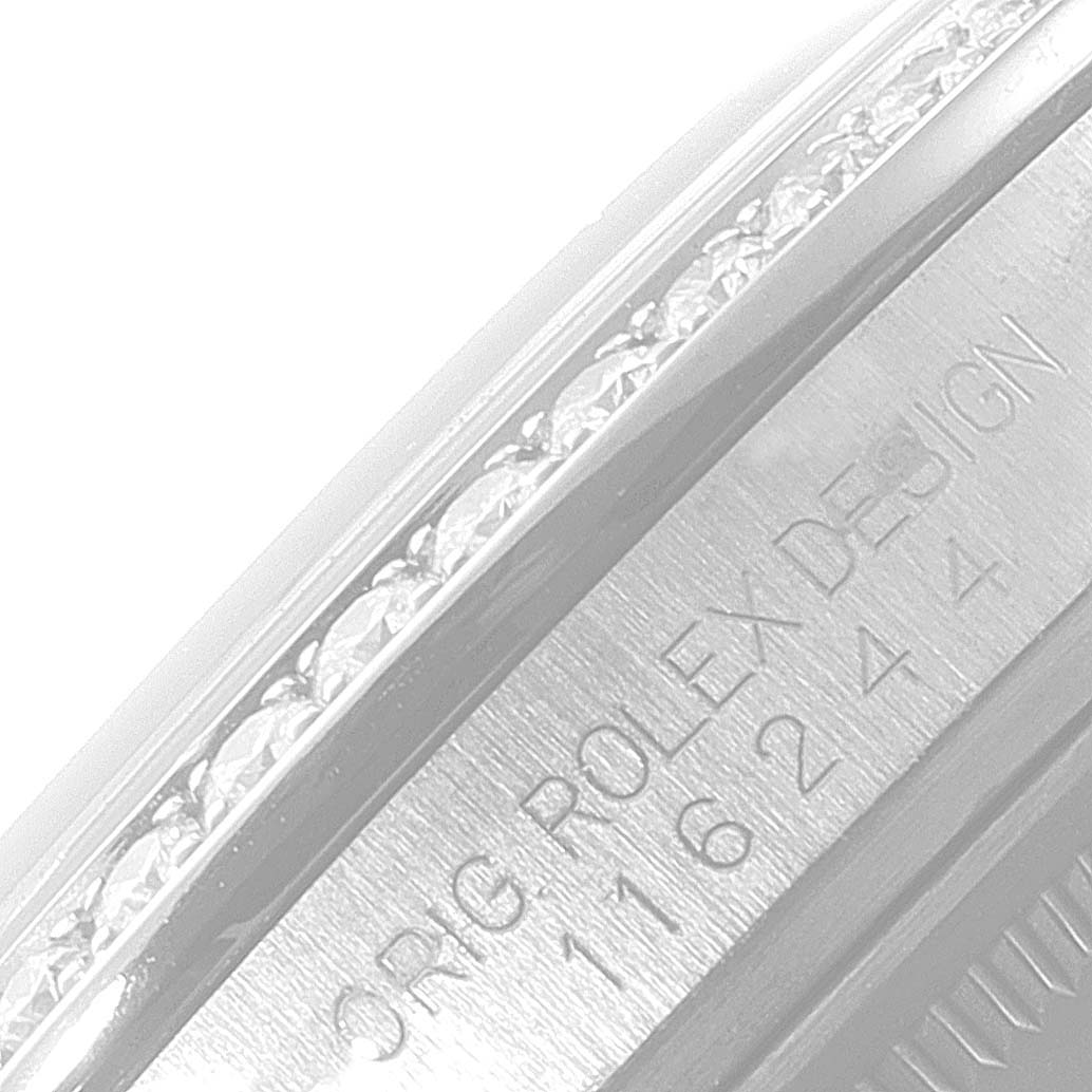 This image shows a close-up of the side of a Rolex Datejust 116244 Men
s Stainless Steel Black Dial 116244 Men
s Stainless Steel Black Dial watch, highlighting the engraved model number and part of the bezel.