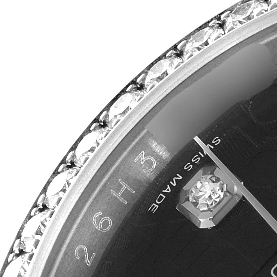 This close-up image of a Rolex Datejust 116244 Men
s Stainless Steel Black Dial 116244 Men
s Stainless Steel Black Dial watch shows part of the bezel with diamonds and a section of the dial.