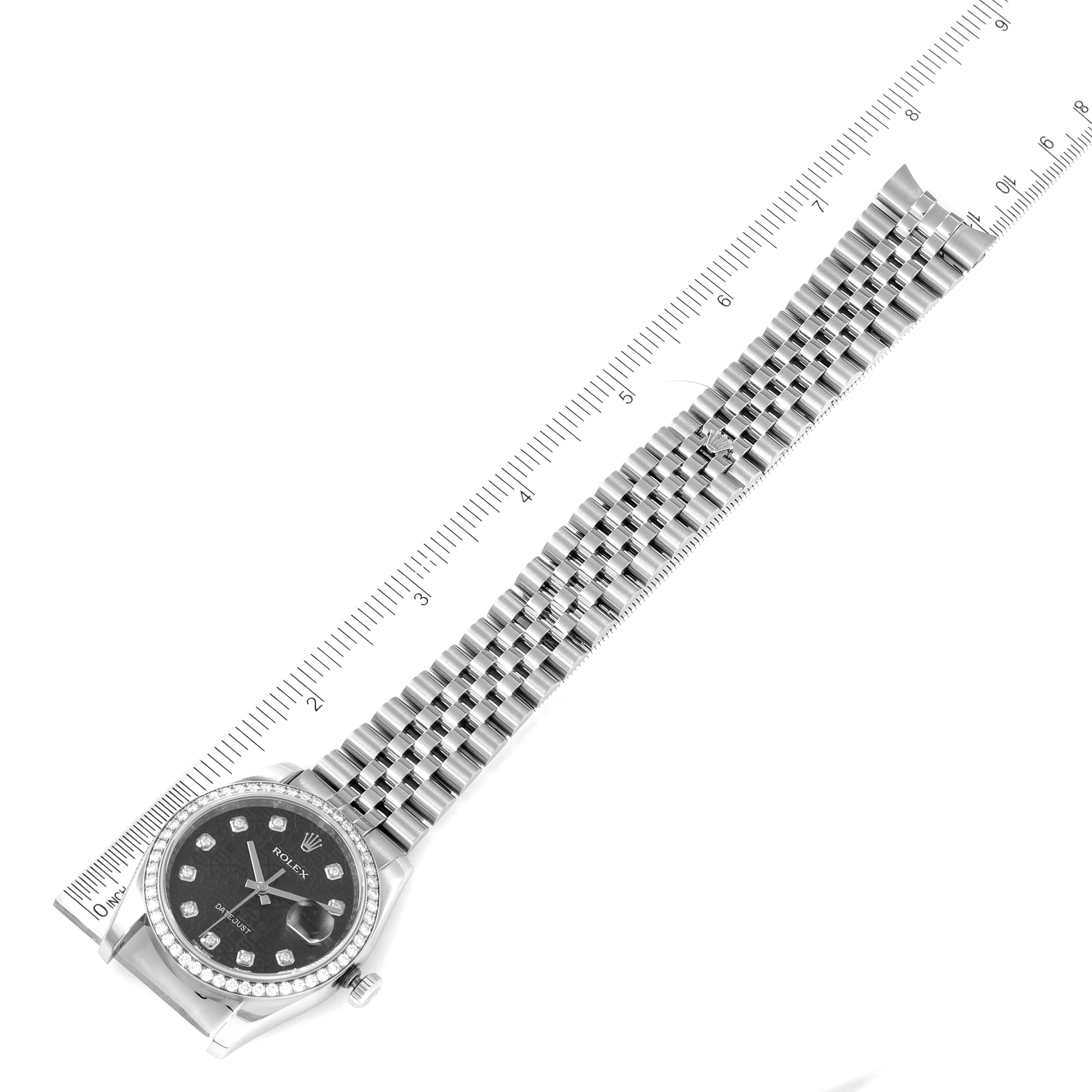 The image shows a top-down view of a Rolex Datejust 116244 Men
s Stainless Steel Black Dial 116244 Men
s Stainless Steel Black Dial watch with the band and a portion of the ruler for size reference.