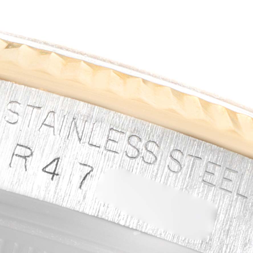 This image shows a close-up of the side engraving on the case of a Rolex Vintage Collection 16013 Men's Steel and Gold (two tone) Champagne Dial 16013 Men's Steel and Gold (two tone) Champagne Dial model, indicating "STAINLESS STEEL."