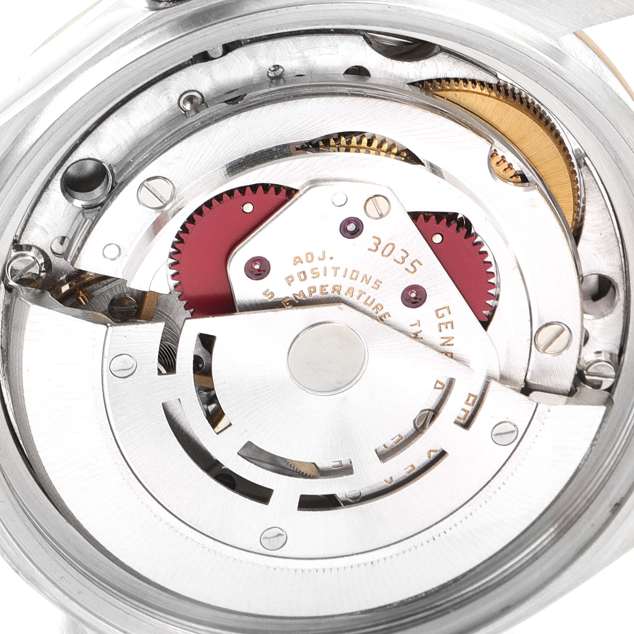 This image shows the inner movement of the Vintage Collection Rolex watch, highlighting gears and intricate components.