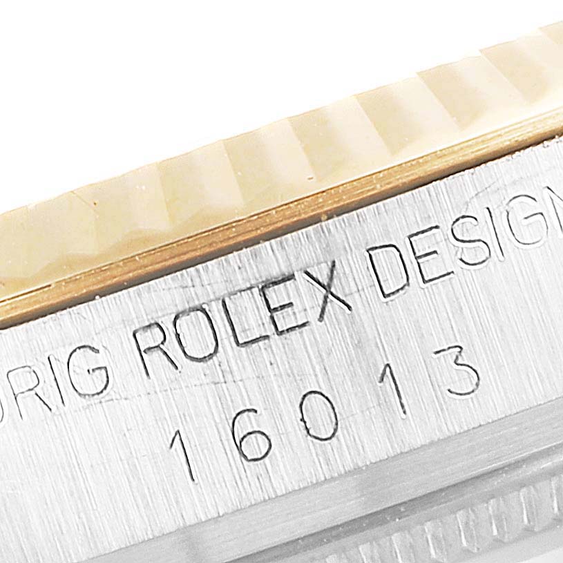 The image shows a close-up of the engraved side of the bezel and case of a Vintage Collection Rolex model 16013.