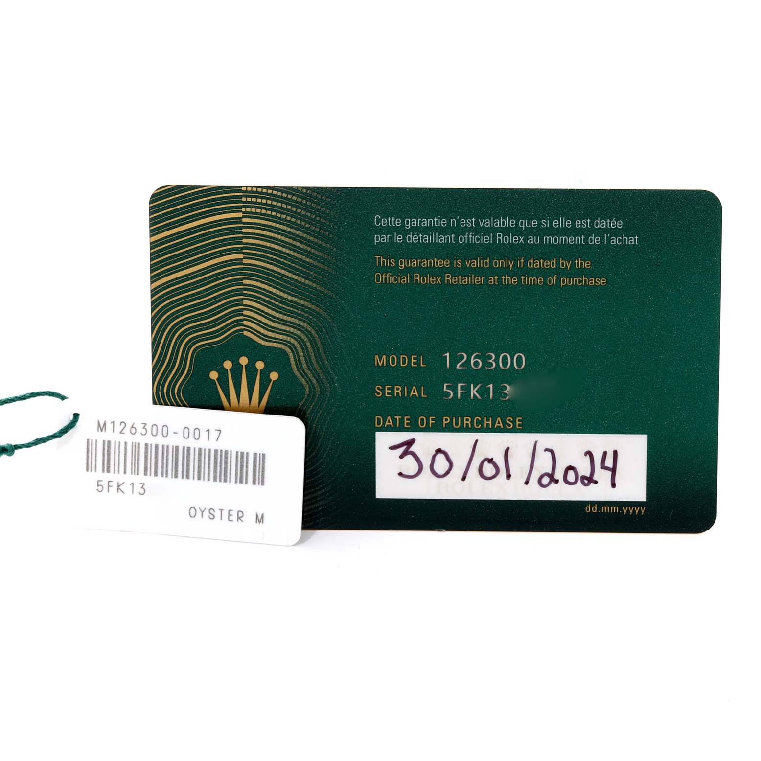 The image shows the guarantee card and tag for the Rolex Datejust 41 126300 Men
s Stainless Steel Blue Dial 126300 Men
s Stainless Steel Blue Dial model 126300, including model and serial numbers.