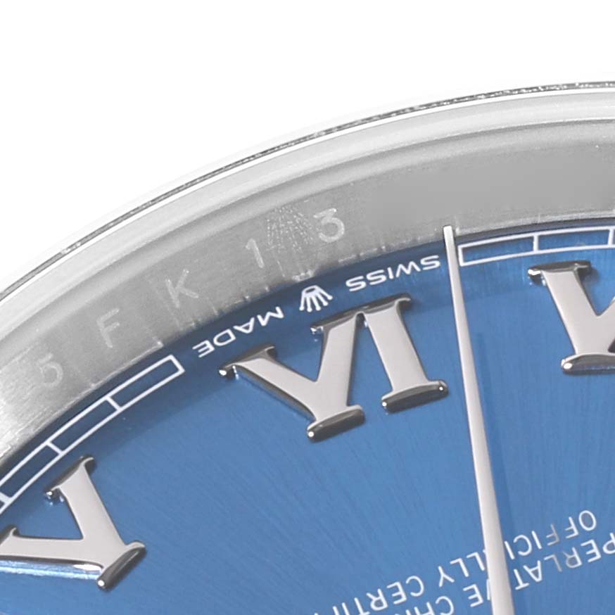 The image shows a close-up of the dial and inner rim of the Rolex Datejust 41 126300 Men
s Stainless Steel Blue Dial 126300 Men
s Stainless Steel Blue Dial, featuring Roman numerals and part of the "Swiss Made" label.
